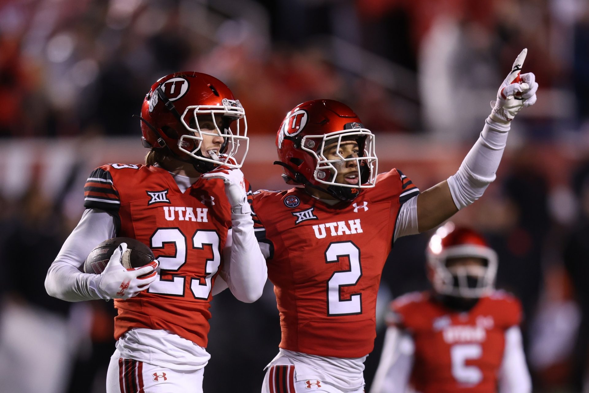 Utah Utes safety Jackson Bennee (23) and cornerback Smith Snowden (2) react to a play against the Arizona State Sun Devils during the third quarter at Rice-Eccles Stadium.