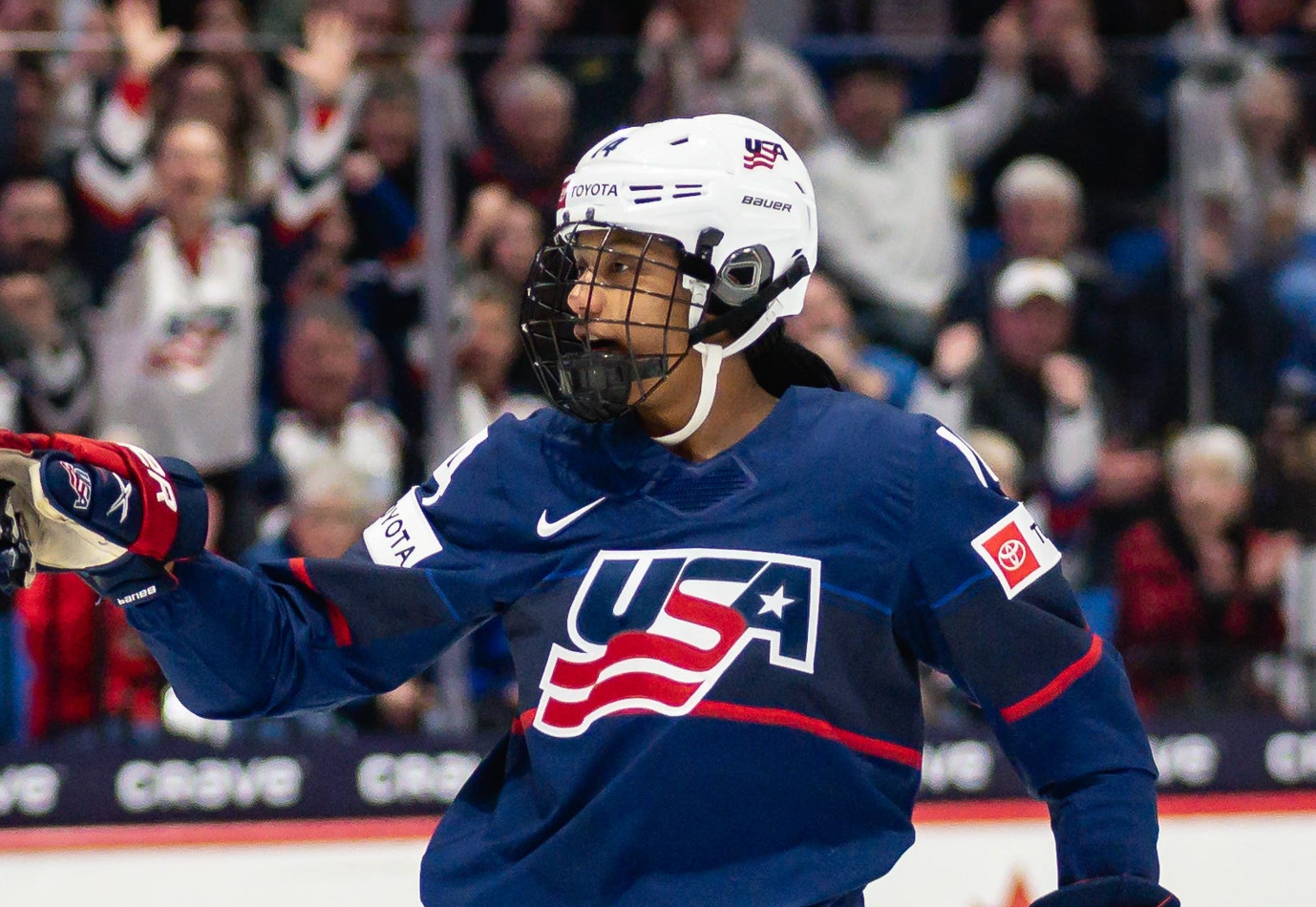USA's Laila Edwards points towards a teammate after scoring a hat-trick against Finland at the Adirondack Bank Center in Utica, NY on Saturday, April 13, 2024.