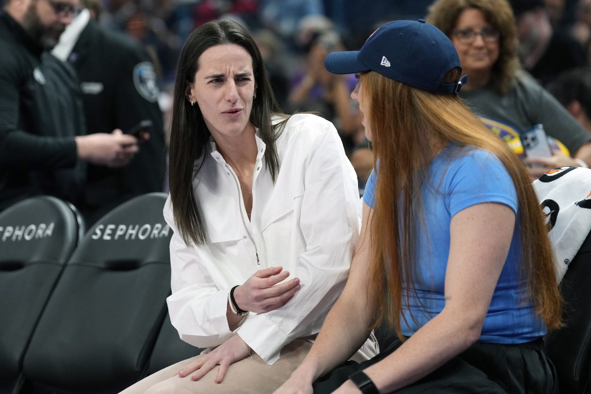 Indiana Fever guard Caitlin Clark (center left) talks with forward Chloe Bibby (right) before the game against the Golden State Valkyries at Chase Center.