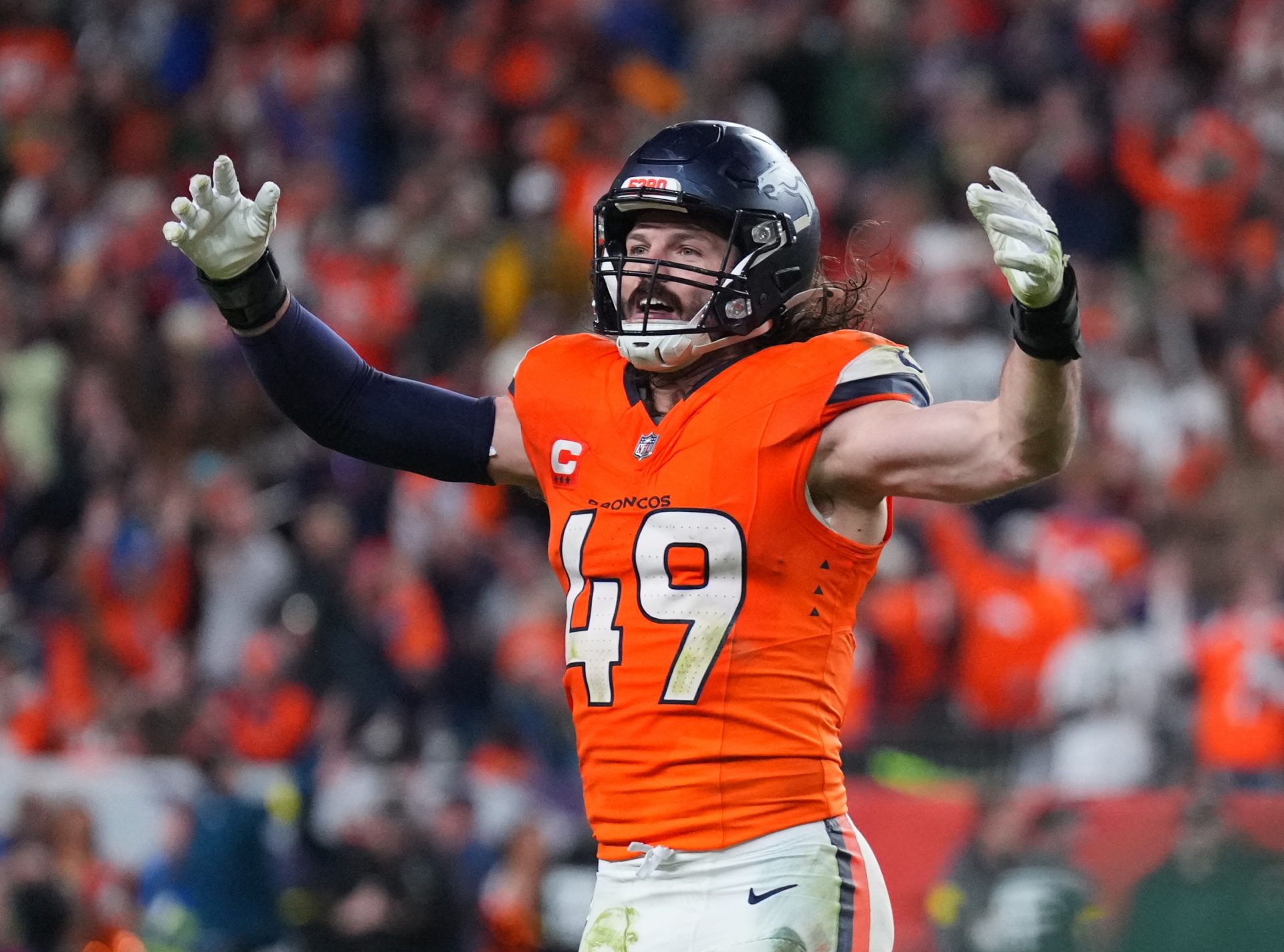 Denver Broncos linebacker Alex Singleton (49) celebrates defeating the Green Bay Packers during the fourth quarter at Empower Field at Mile High.