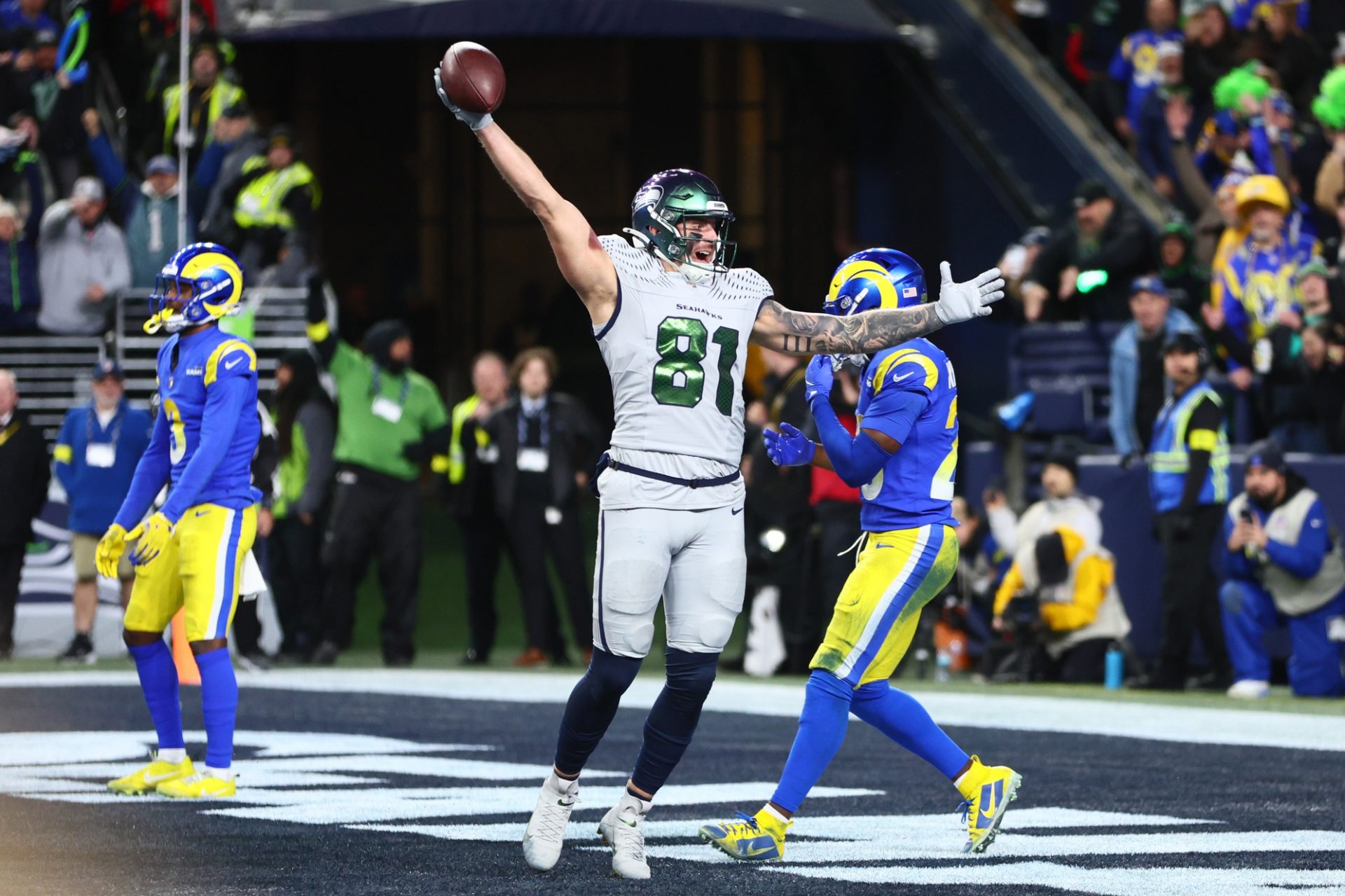 Seattle Seahawks tight end Eric Saubert (81) celebrates after making a catch for a game-winning two-point conversion against the Los Angeles Rams in overtime at Lumen Field.