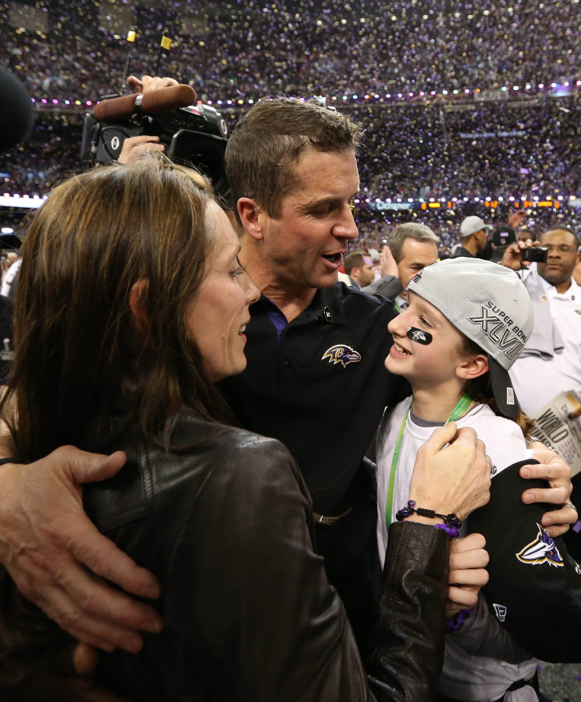 Baltimore Ravens head coach John Harbaugh celebrates with his wife Ingrid Harbaugh (left) and daughter Alison Harbaugh (right) after defeating the San Francisco 49ers 34-31 in Super Bowl XLVII at the Mercedes-Benz Superdome.