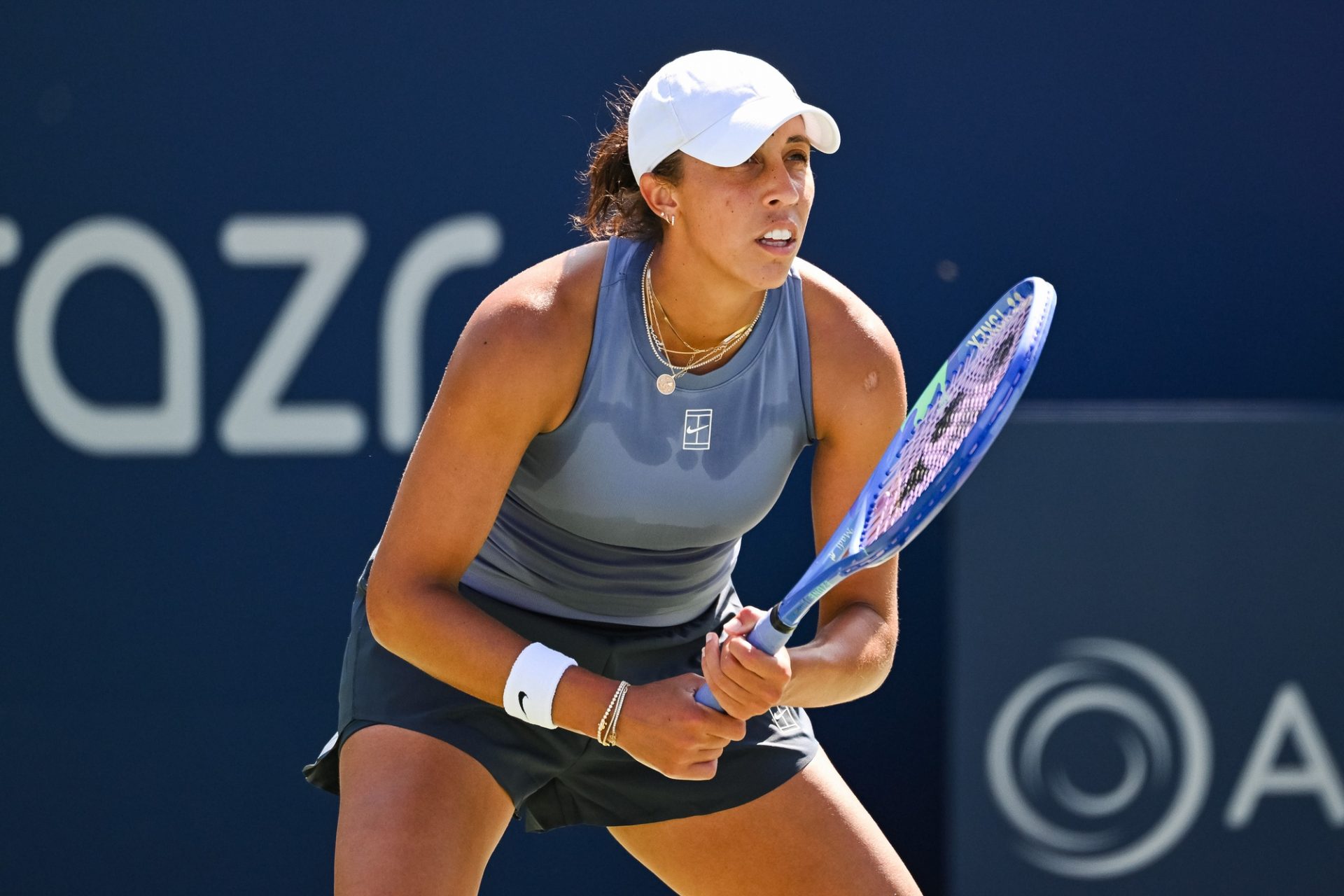 Madison Keys (USA) waits for Caty Mcnally (USA) to serve the ball in third round play at IGA Stadium.