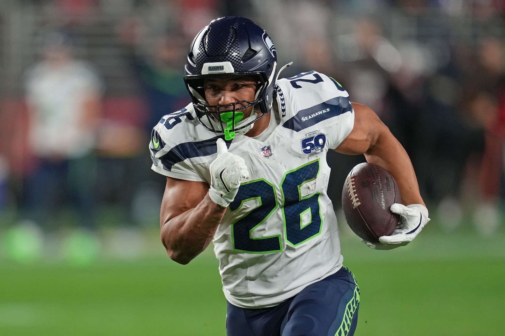 Seattle Seahawks running back Zach Charbonnet (26) rushes the ball against the San Francisco 49ers during the first half at Levi's Stadium.