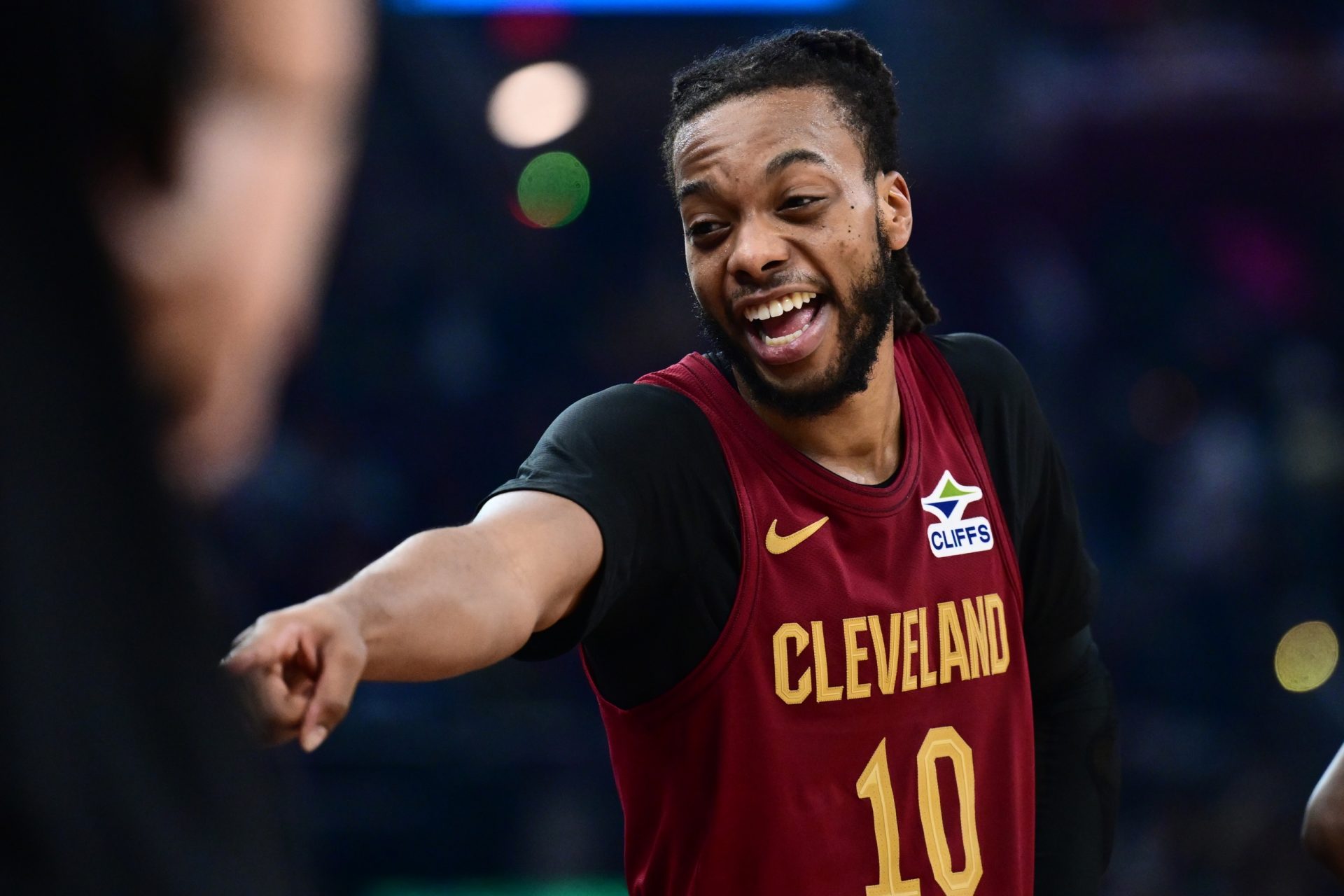 Cleveland Cavaliers guard Darius Garland (10) laughs at a fan after the ball hit him and spilled his drink during the first half of the game against the Utah Jazz at Rocket Arena.