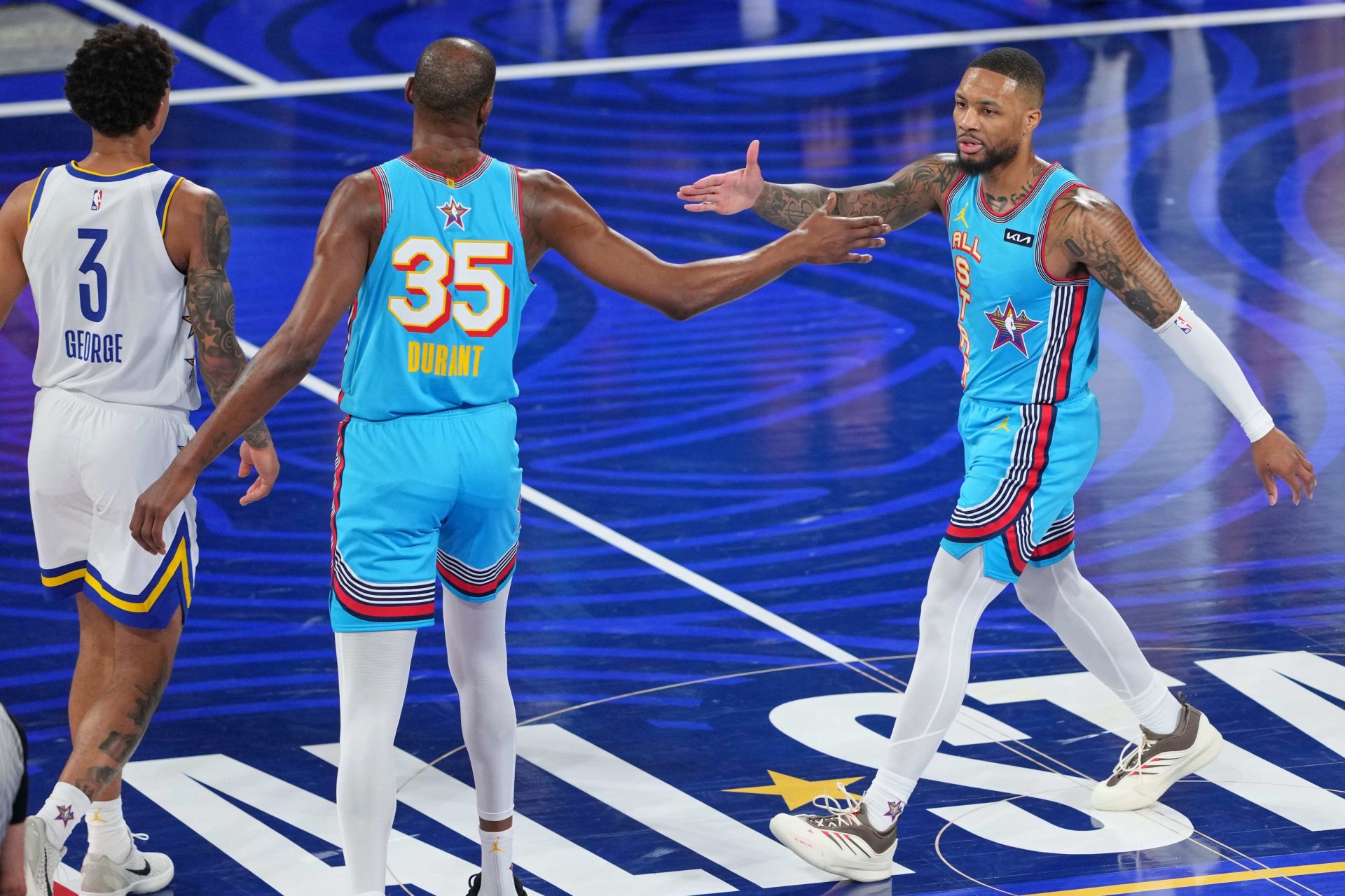 Shaqs OGs guard Damian Lillard (0) of the Milwaukee Bucks high fives forward Kevin Durant (35) of the Sacramento Kings after a play during the 2025 NBA All Star Game at Chase Center.