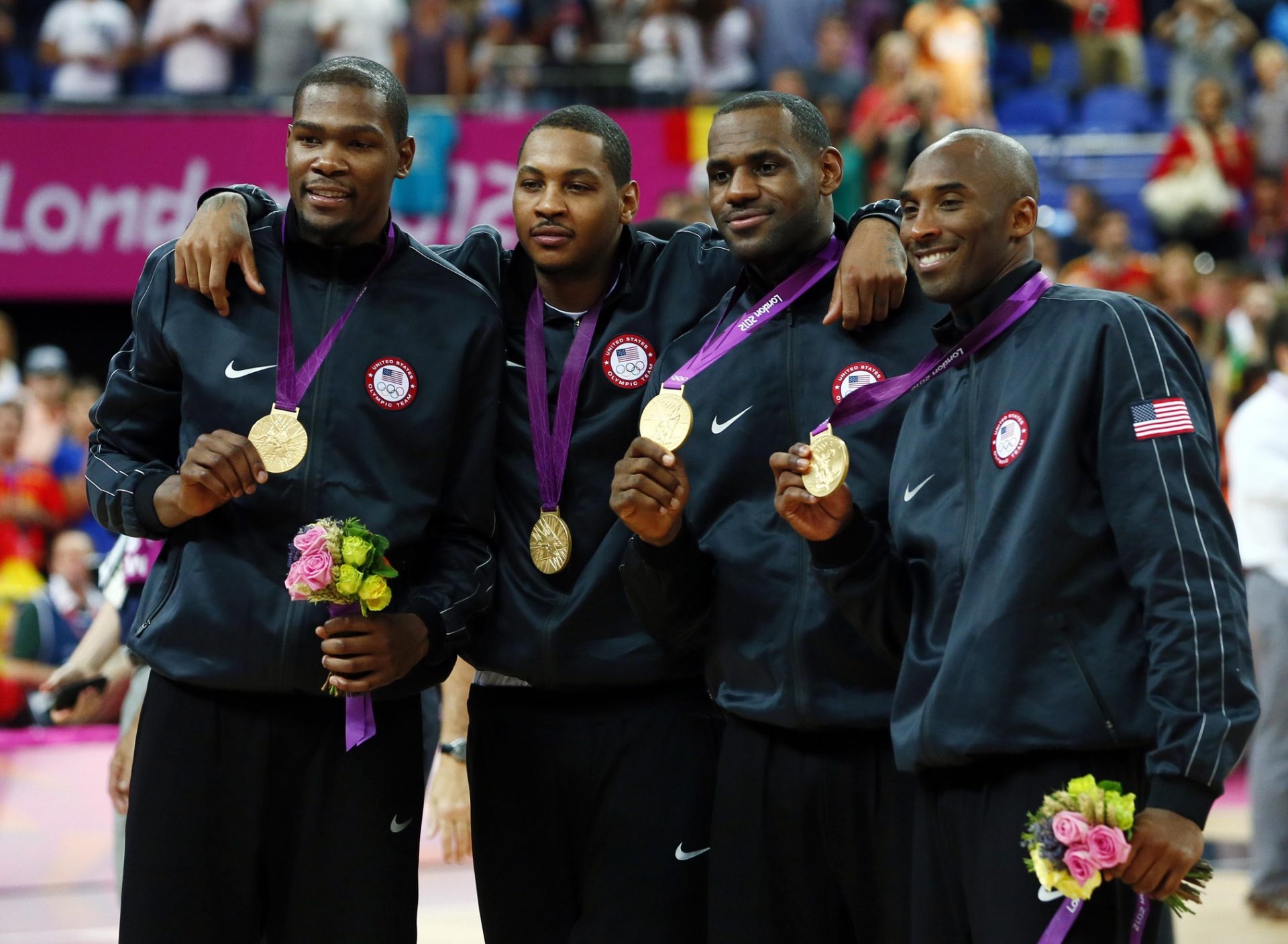 USA players from left Kevin Durant , Carmelo Anthony , LeBron James and Kobe Bryant pose with their gold medals after defeating Spain 107-100 during the men's basketball gold medal game in the London 2012 Olympic Games at North Greenwich Arena.