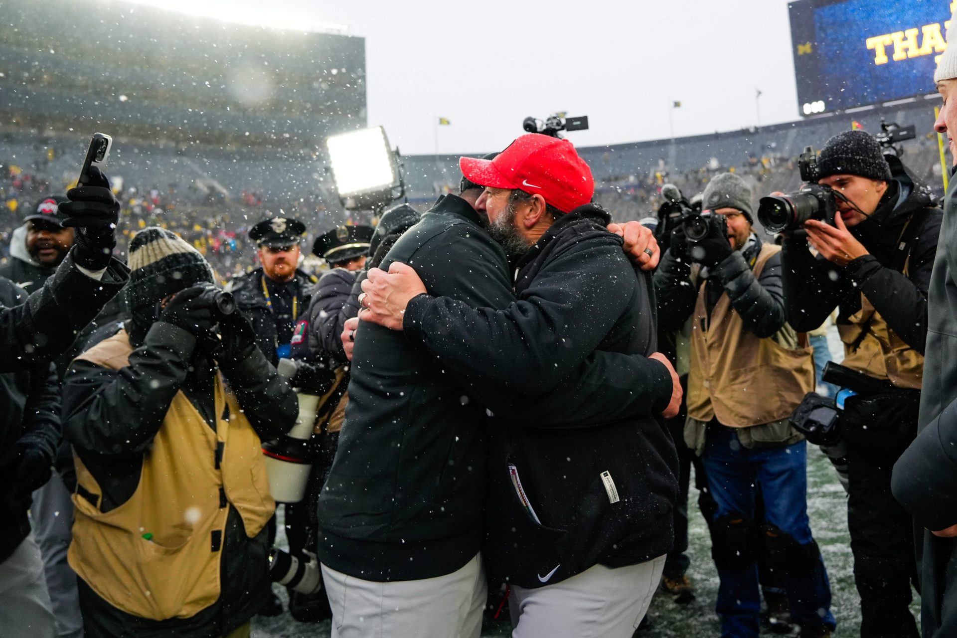 Ohio State Buckeyes head coach Ryan Day embraces defensive coordinator Matt Patricia after defeating the Michigan Wolverines in the NCAA football game at Michigan Stadium on Saturday, Nov. 29, 2025 in Ann Arbor, Michigan.