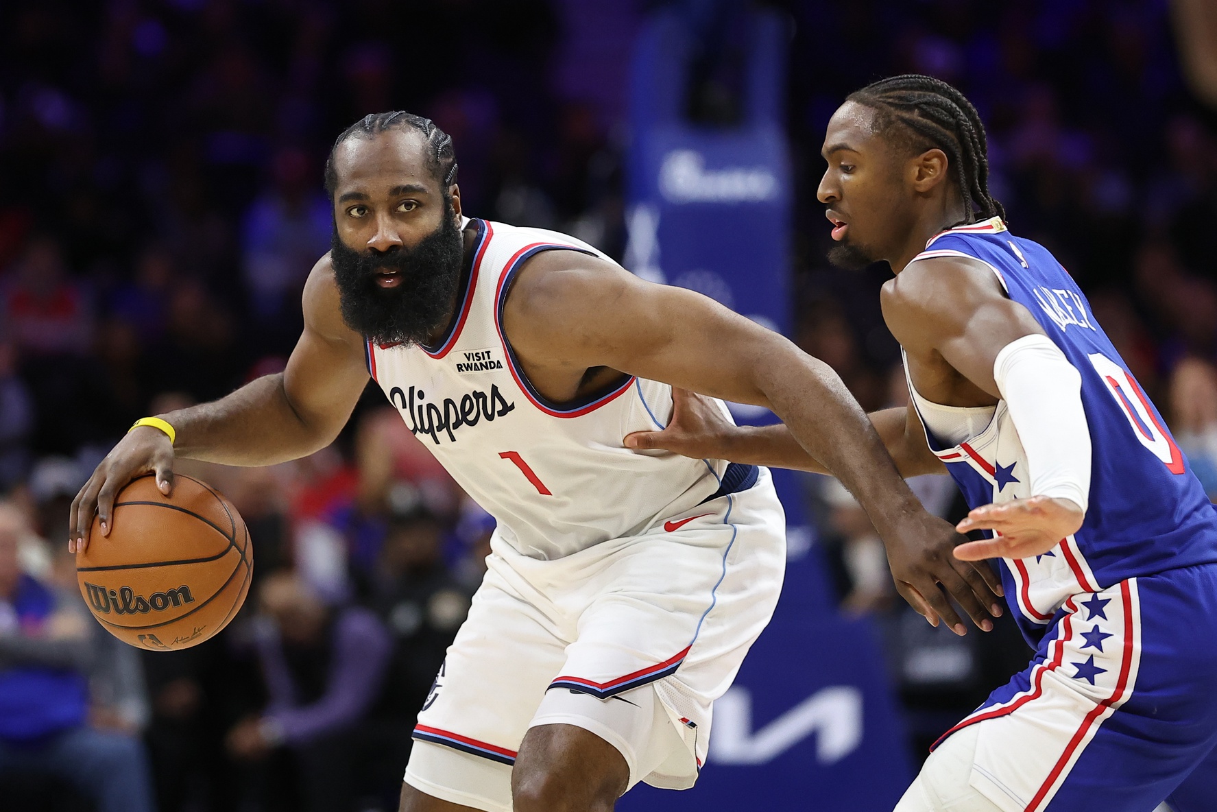 LA Clippers guard James Harden (1) controls the ball against Philadelphia 76ers guard Tyrese Maxey (0) during the fourth quarter at Xfinity Mobile Arena.