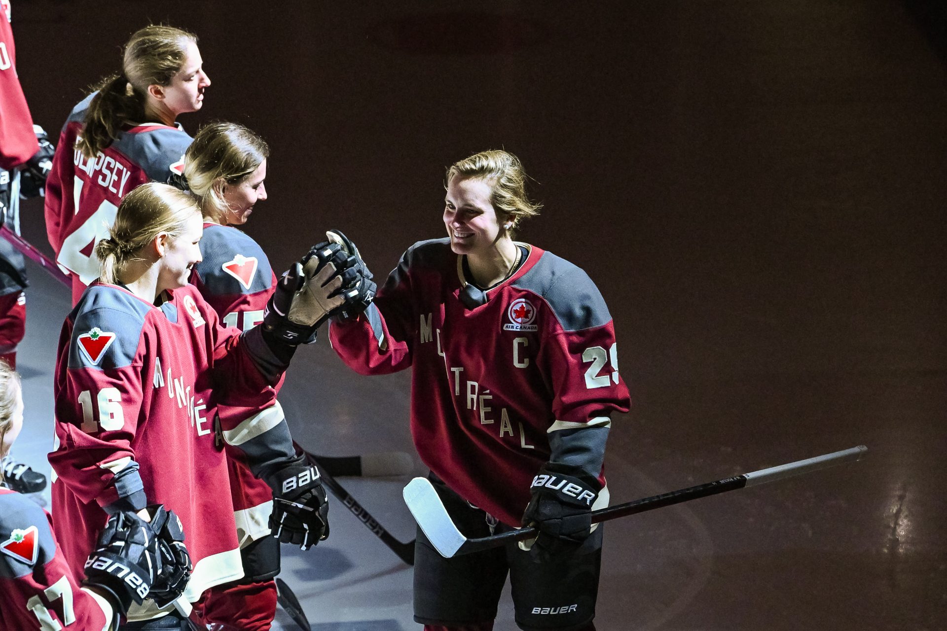 Montreal forward Marie-Philip Poulin (29) greets forward Sarah Lefort (16) during the opening ceremony before a PWHL ice hockey game at Verdun Auditorium.