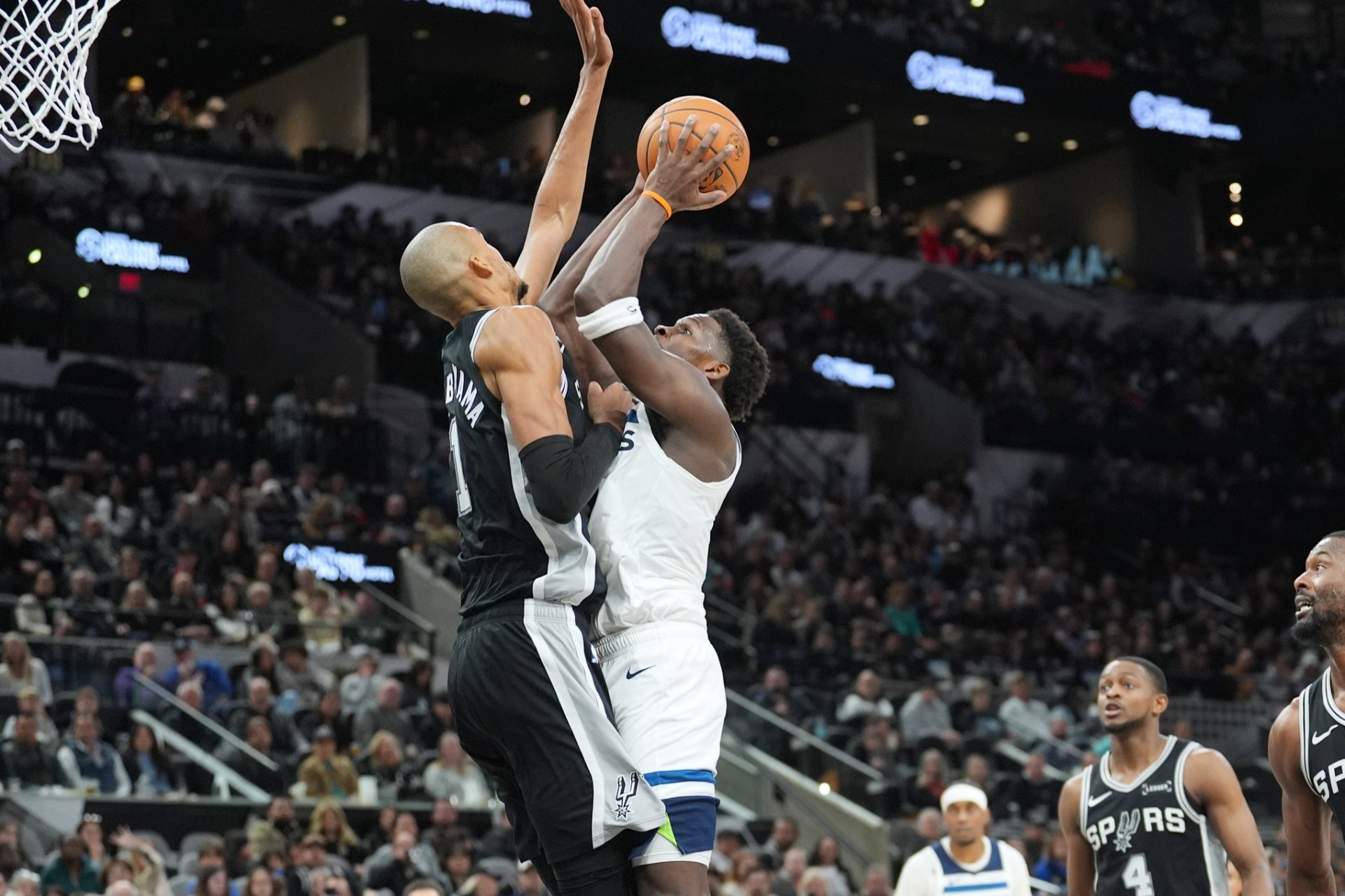 Minnesota Timberwolves guard Anthony Edwards (5) shoots against San Antonio Spurs forward Victor Wembanyama (1) in the first half at Frost Bank Center.