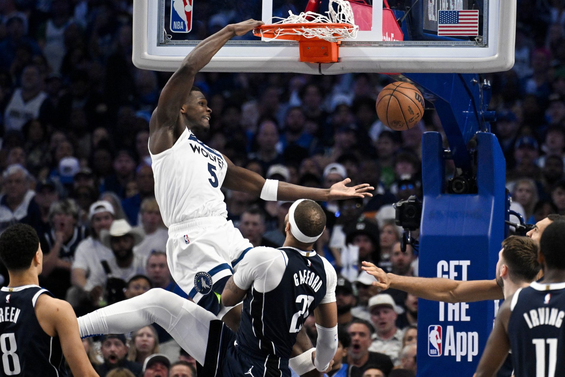 Minnesota Timberwolves guard Anthony Edwards (5) dunks the ball over Dallas Mavericks center Daniel Gafford (21) during game three of the western conference finals for the 2024 NBA playoffs at American Airlines Center.
