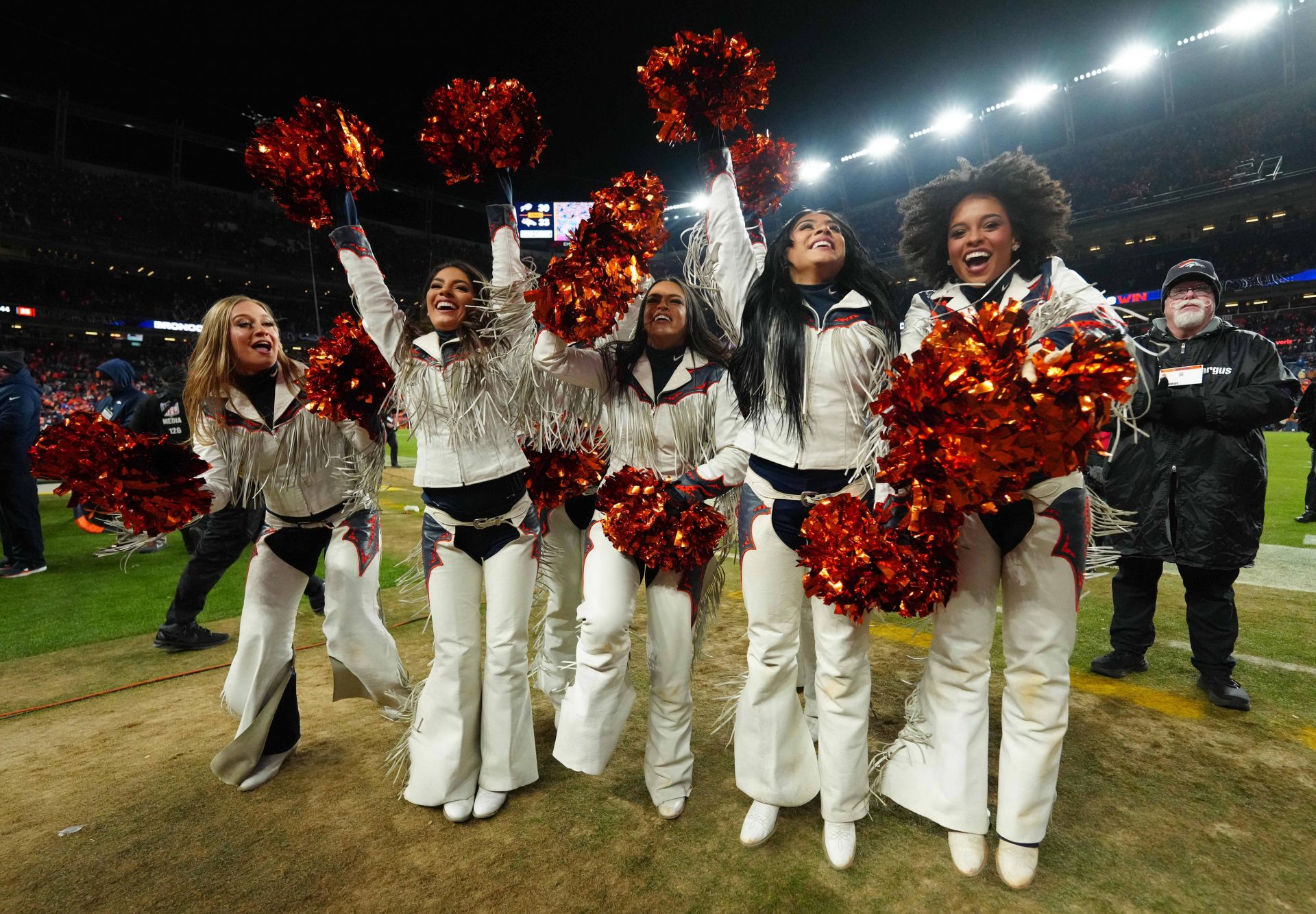 Denver Broncos cheerleaders celebrate after winning an AFC Divisional Round playoff game against the Buffalo Bills at Empower Field at Mile High.