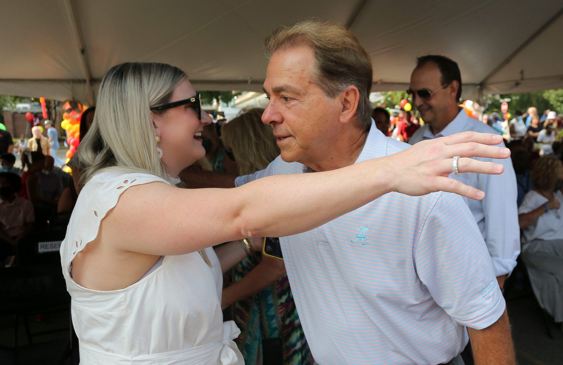 The City of Tuscaloosa renamed 28th Avenue as Nick's Kids Avenue Thursday, Aug. 5, 2021. Nick Saban greets his daughter, Kristen Saban Setas, at the unveiling ceremony. [Staff Photo/Gary Cosby Jr.]

Nick S Kids Avenue