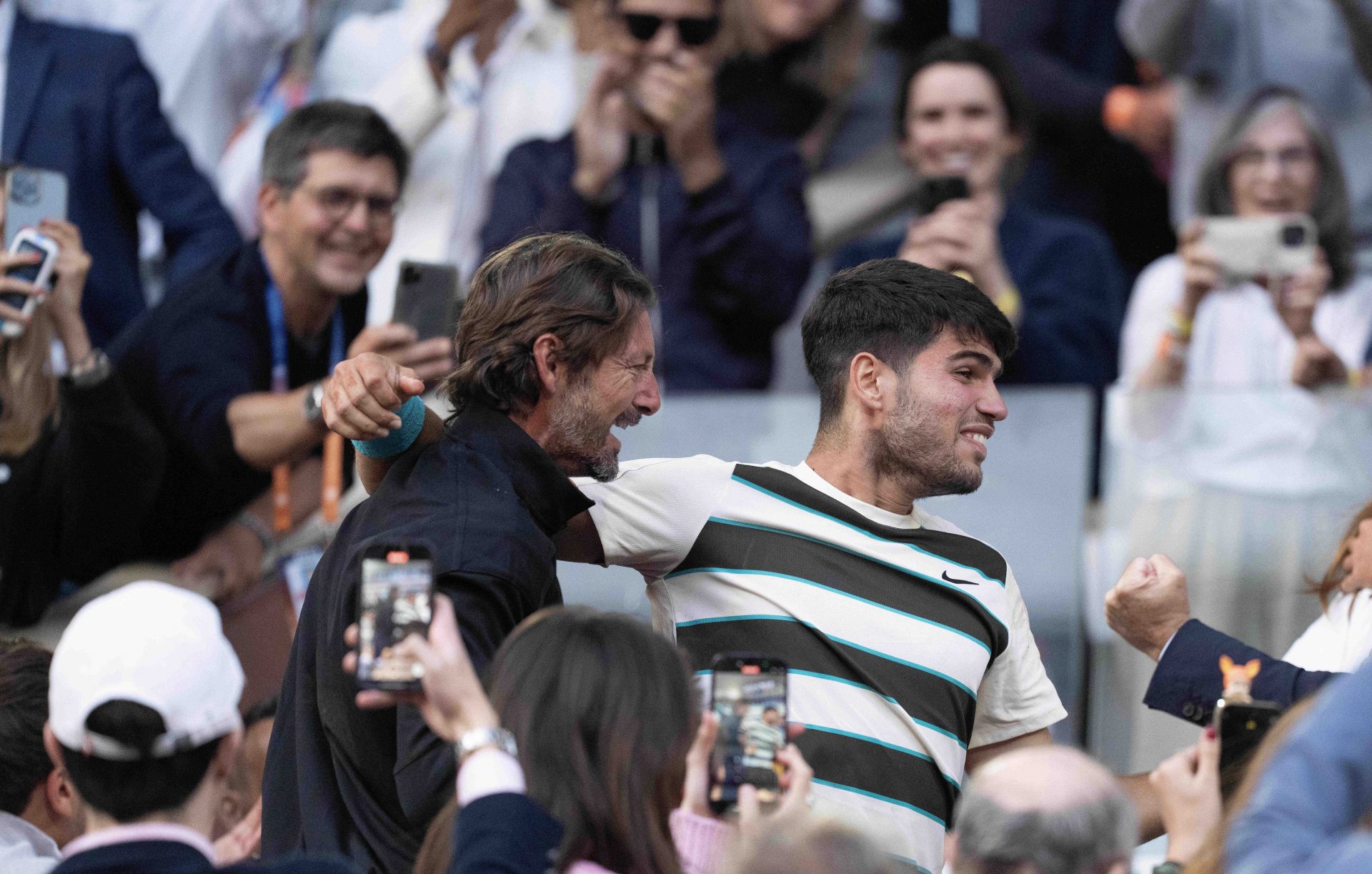 Carlos Alcaraz of Spain celebrates with his coach, Juan Carlos Ferrero after winning the men’s singles final against Jannik Sinner of Italy on day 15 at Roland Garros Stadium.
