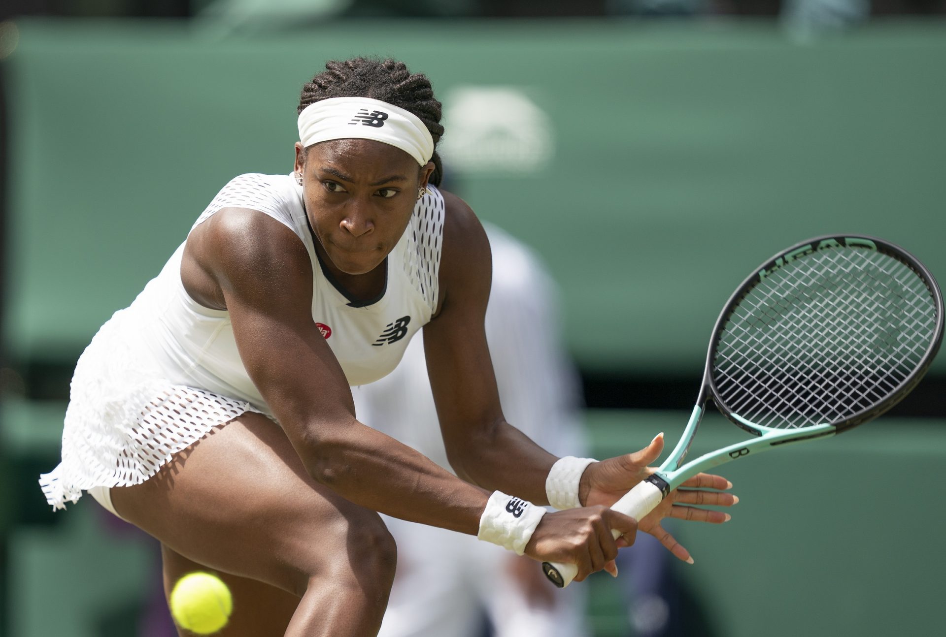 Coco Gauff (USA) returns a shot during her match against Amanda Anisimova (USA) on day six at All England Lawn Tennis and Croquet Club.