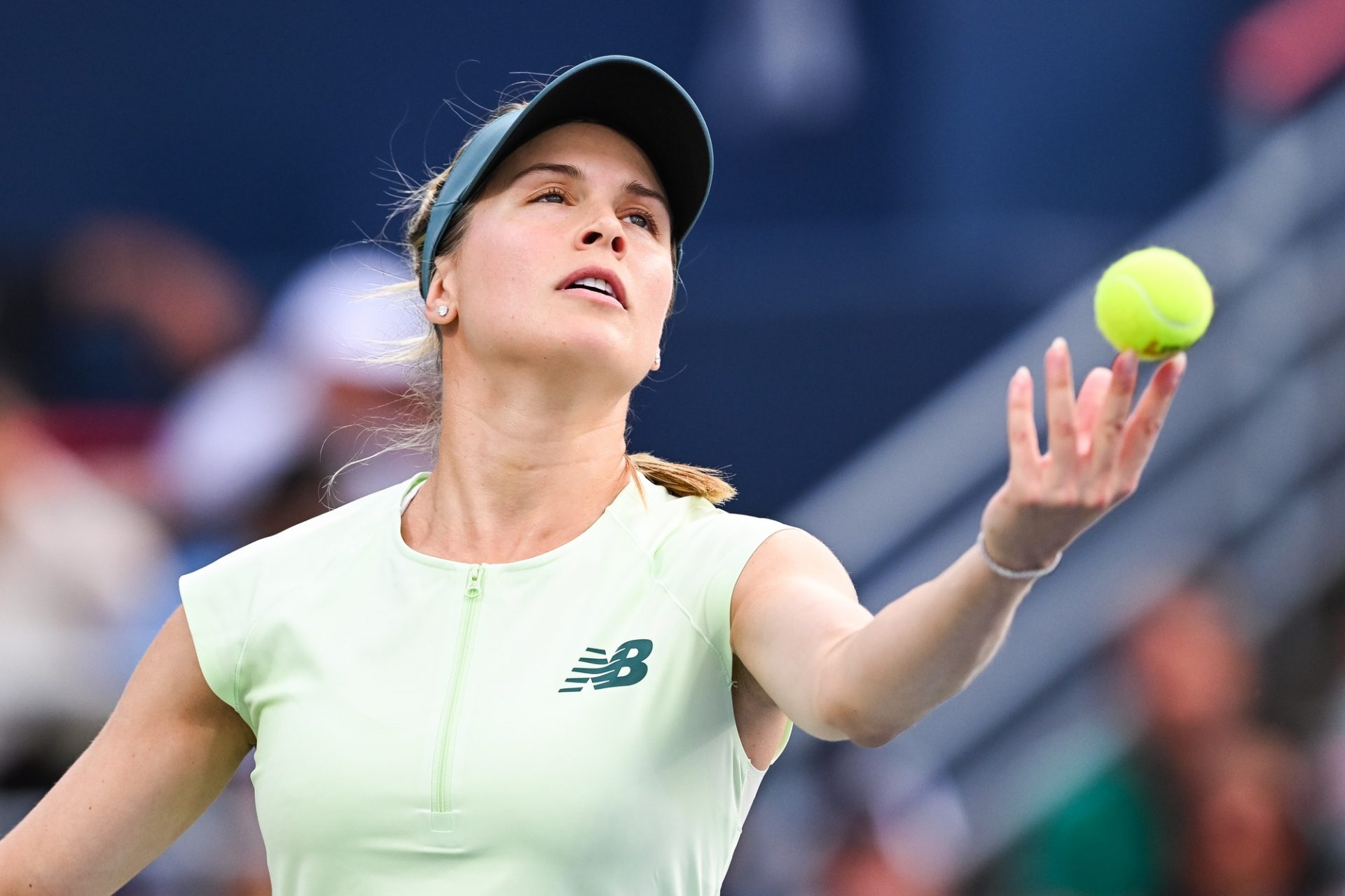 Eugenie Bouchard (CAN) serves the ball to Belinda Bencic (SUI) in second round play at IGA Stadium.