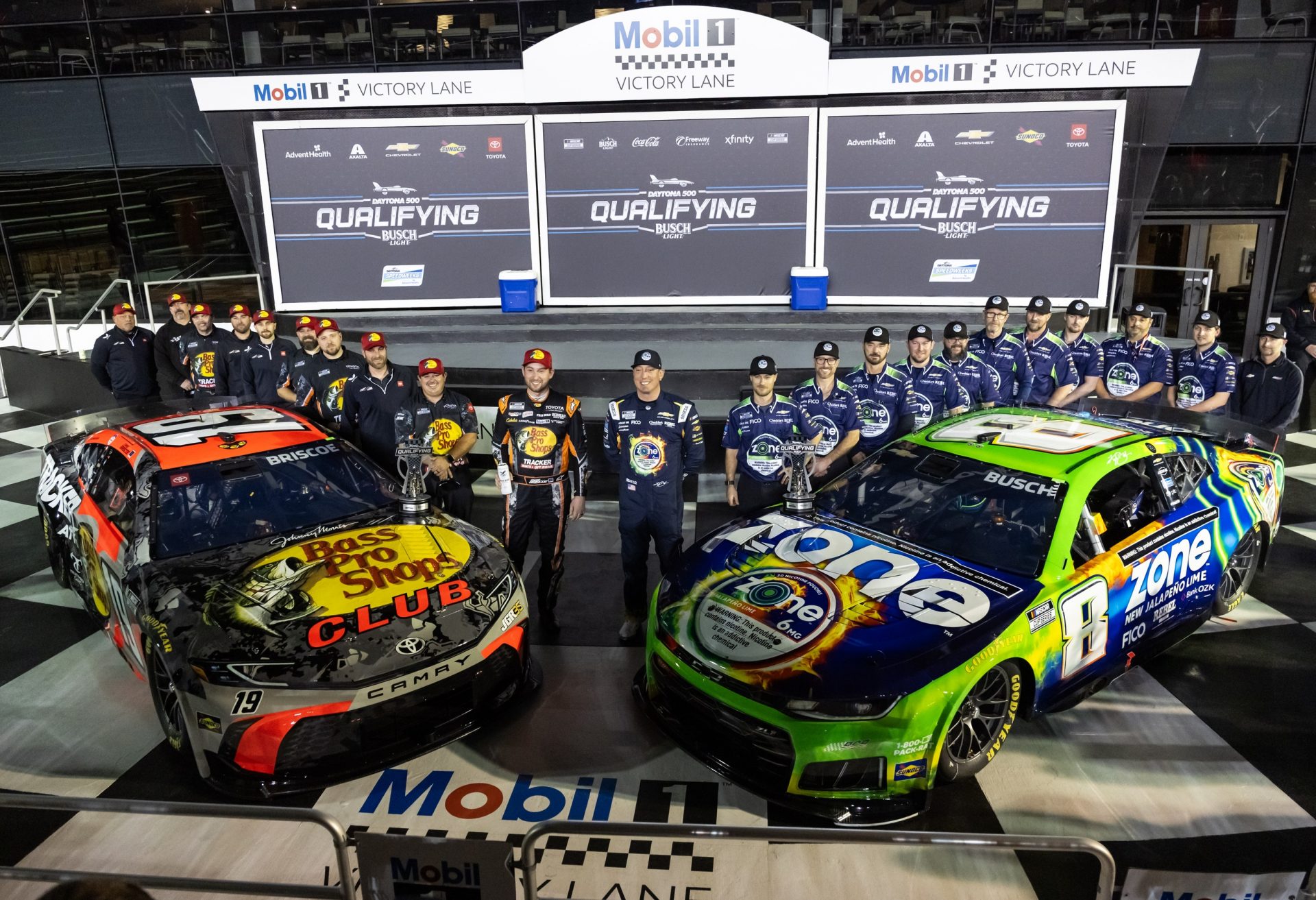 NASCAR Cup Series driver Kyle Busch (8) and Chase Briscoe (19) and crew celebrate after securing the front row during qualifying for the Daytona 500 at Daytona International Speedway.