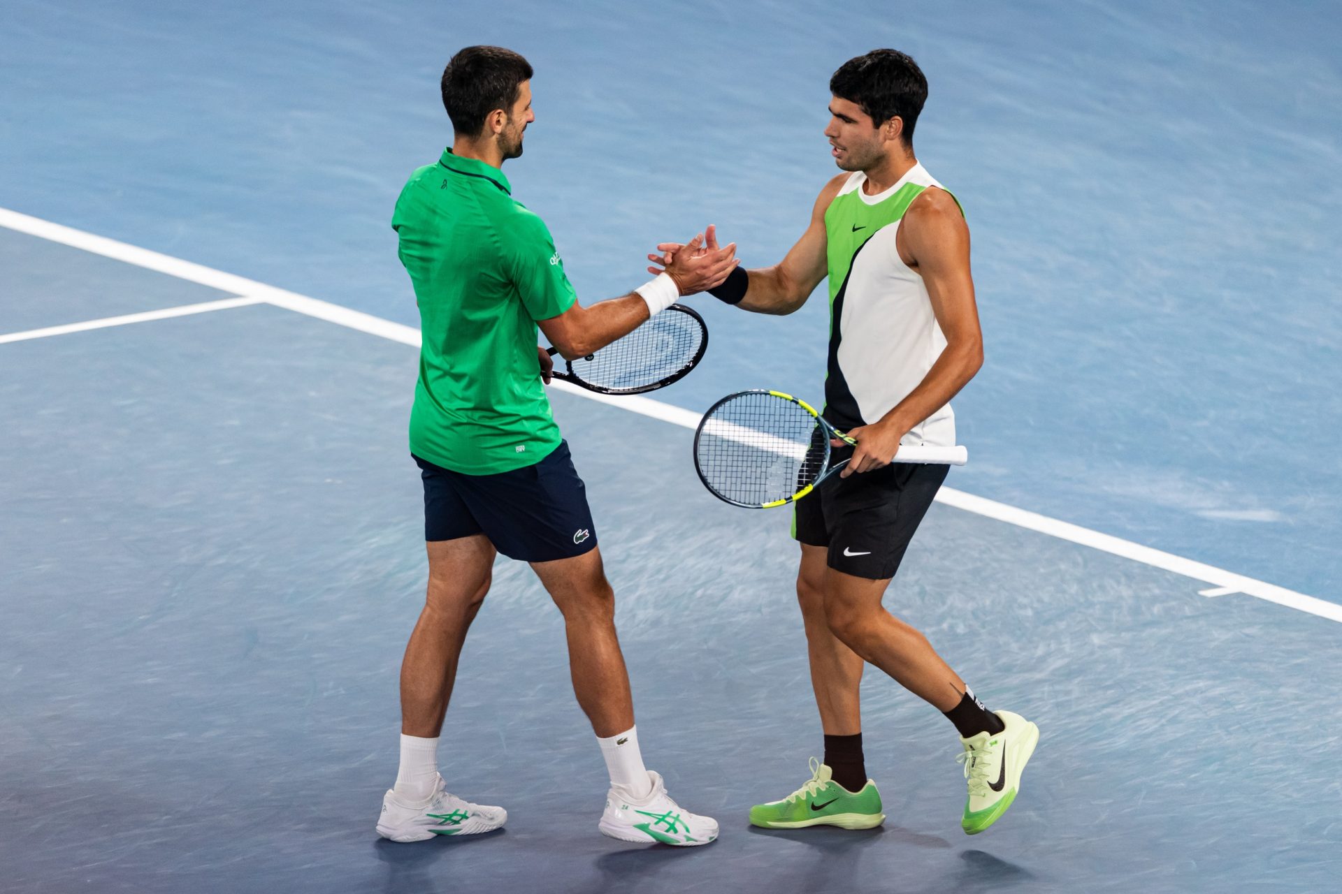 Carlos Alcaraz of Spain and Novak Djokovic of Serbia embrace after the final of the mens singles at the Australian Open at Rod Laver Arena in Melbourne Park.