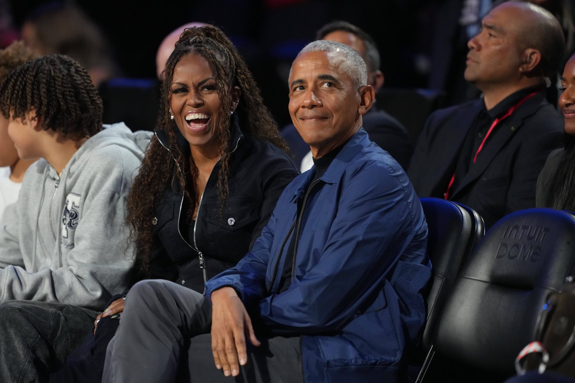 Former first lady Michelle Obama and former President Barack Obama look on before the start of the 75th NBA All Star Game at Intuit Dome.