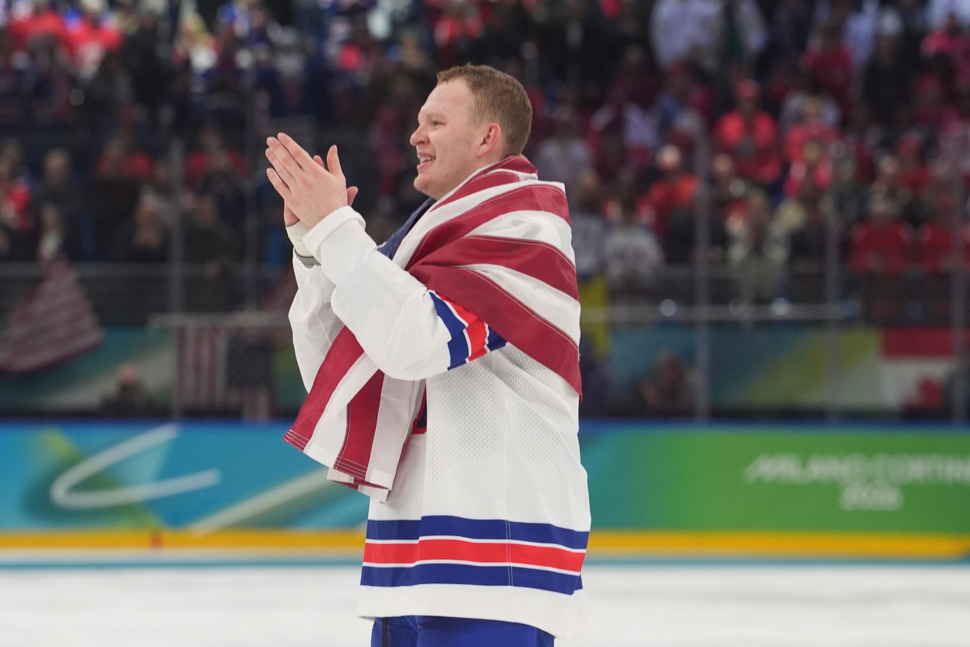 Brady Tkachuk (7) of the United States celebrates after defeating Canada in the men's ice hockey gold medal game during the Milano Cortina 2026 Olympic Winter Games at Milano Santagiulia Ice Hockey Arena.