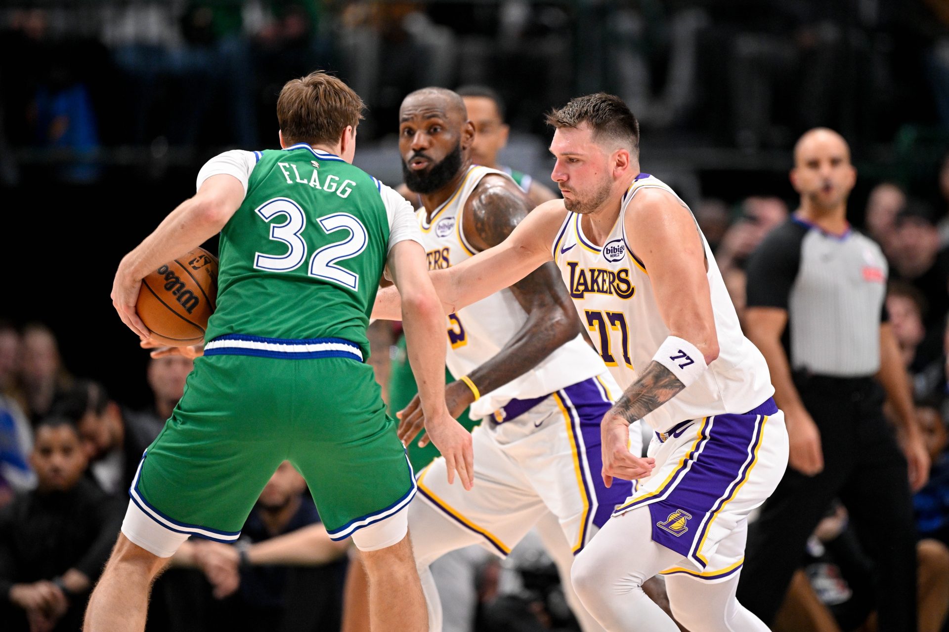 Dallas Mavericks forward Cooper Flagg (32) looks to move the ball past Los Angeles Lakers forward LeBron James (23) and guard Luka Doncic (77) during the second half at the American Airlines Center.