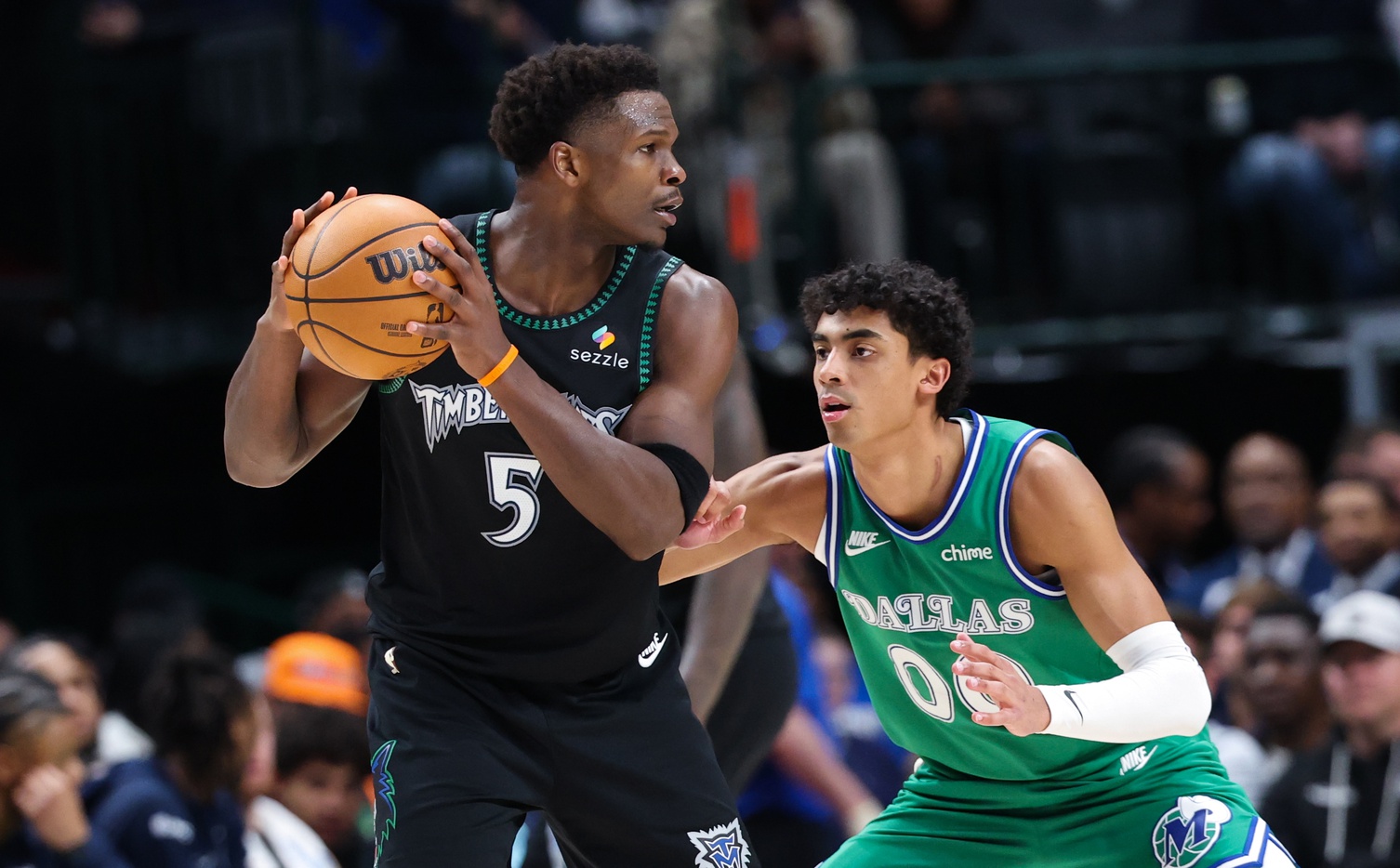 Minnesota Timberwolves guard Anthony Edwards (5) looks to score as Dallas Mavericks guard Max Christie (00) defends during the second half at American Airlines Center.