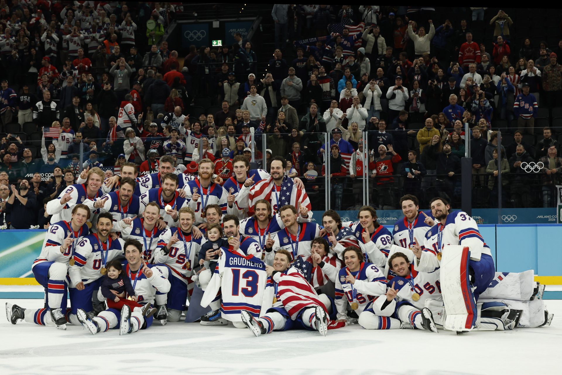 Team United States celebrate on the ice after the medal ceremony during the Milano Cortina 2026 Olympic Winter Games at Milano Santagiulia Ice Hockey Arena.