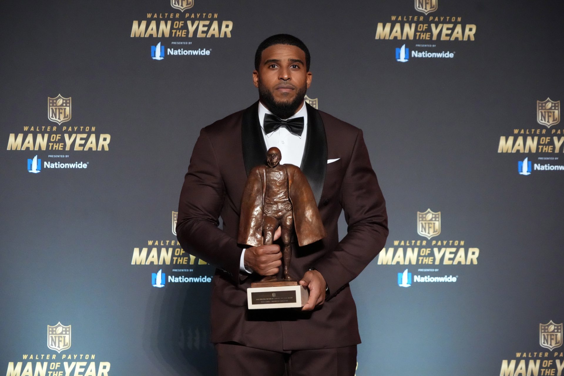Washington Commanders linebacker Bobby Wagner poses with the Walter Payton Man of the Year award at the NFL Honors show at Palace of Fine Arts.