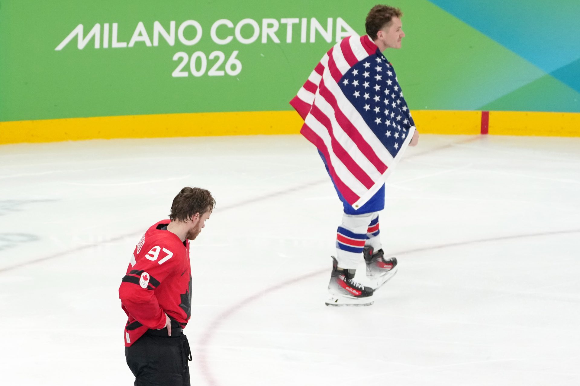 Matthew Tkachuk of the United States and Connor McDavid of Canada reacts after the men's ice hockey gold medal game during the Milano Cortina 2026 Olympic Winter Games at Milano Santagiulia Ice Hockey Arena.