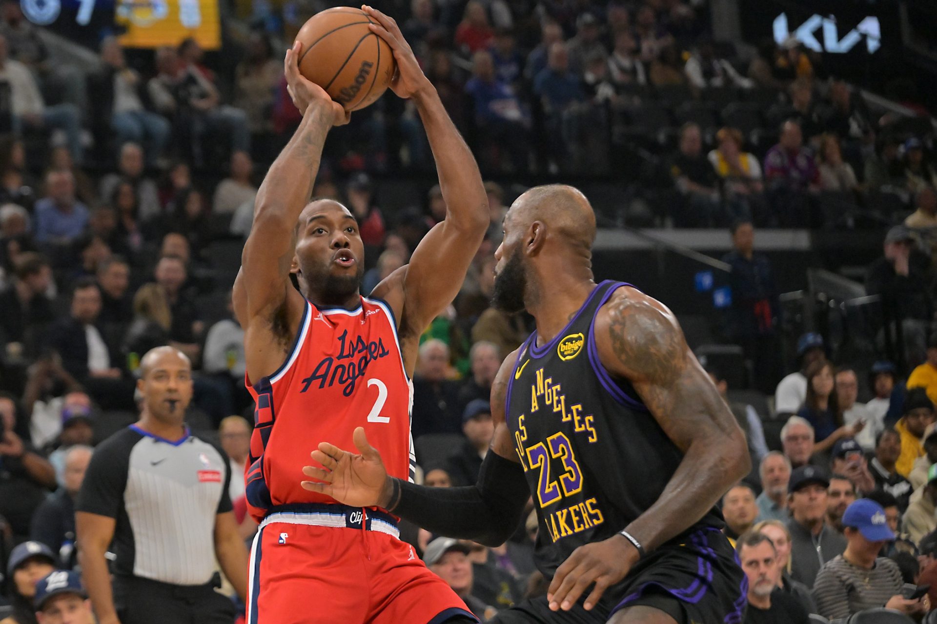 Los Angeles Lakers forward LeBron James (23) defends a shot by Los Angeles Clippers forward Kawhi Leonard (2) in the first half at Intuit Dome.