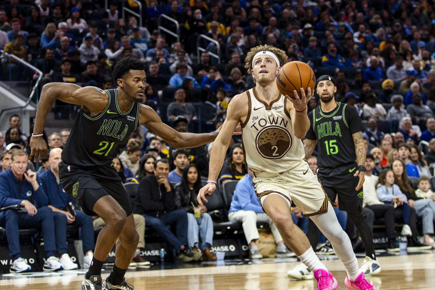 New Orleans Pelicans center Yves Missi (21) defends Golden State Warriors guard Brandin Podziemski (2) during the third quarter at Chase Center.
