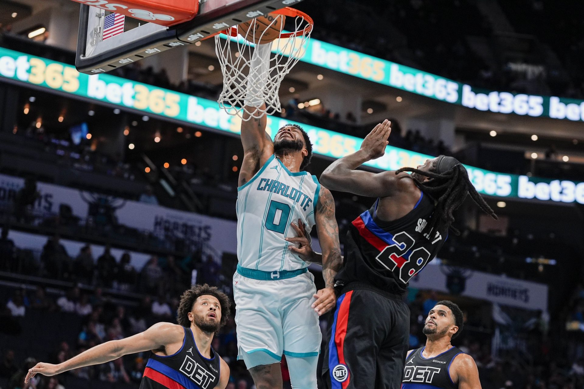 Charlotte Hornets forward Miles Bridges (0) goes up for a dunk against Detroit Pistons center Isaiah Stewart (28) during the second half at Spectrum Center.