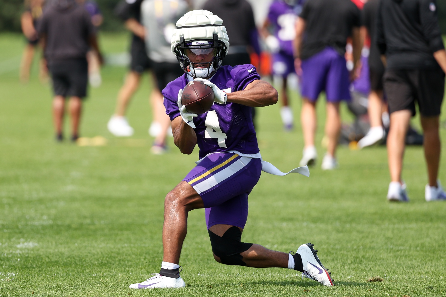 Minnesota Vikings wide receiver Rondale Moore (4) takes part in drills during the teams training camp at the Minnesota Vikings Training Facility.