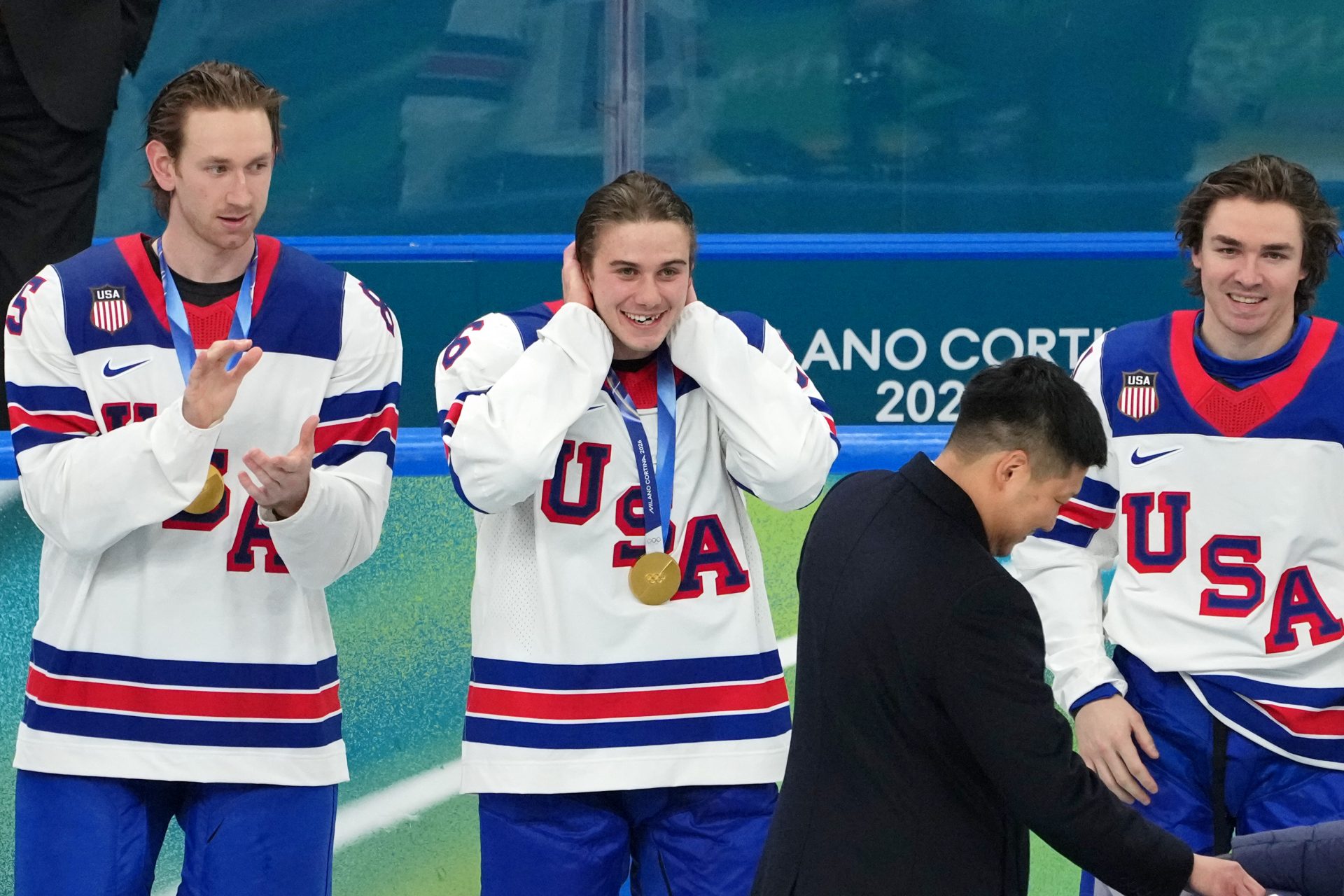 Jack Hughes of the United States reacts after getting his gold medal after winning the men's ice hockey gold medal game during the Milano Cortina 2026 Olympic Winter Games at Milano Santagiulia Ice Hockey Arena.
