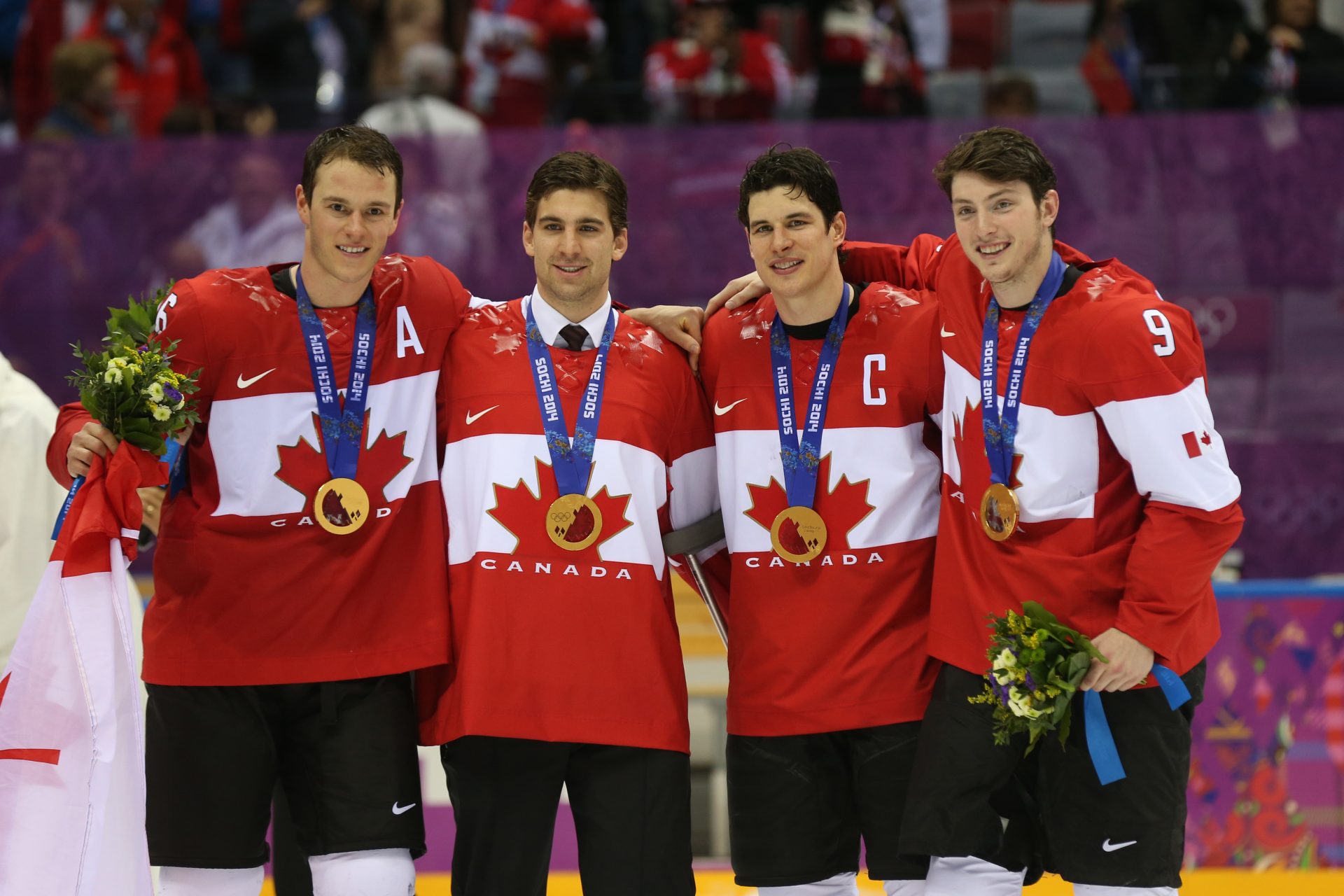 Canada forward Jonathan Toews (16), Canada forward Jon Tavares (20), Canada forward Sidney Crosby (87), and Canada forward Matt Duchene (9) celebrate winning the gold medal against Sweden in the men's ice hockey gold medal game during the Sochi 2014 Olympic Winter Games at Bolshoy Ice Dome.
