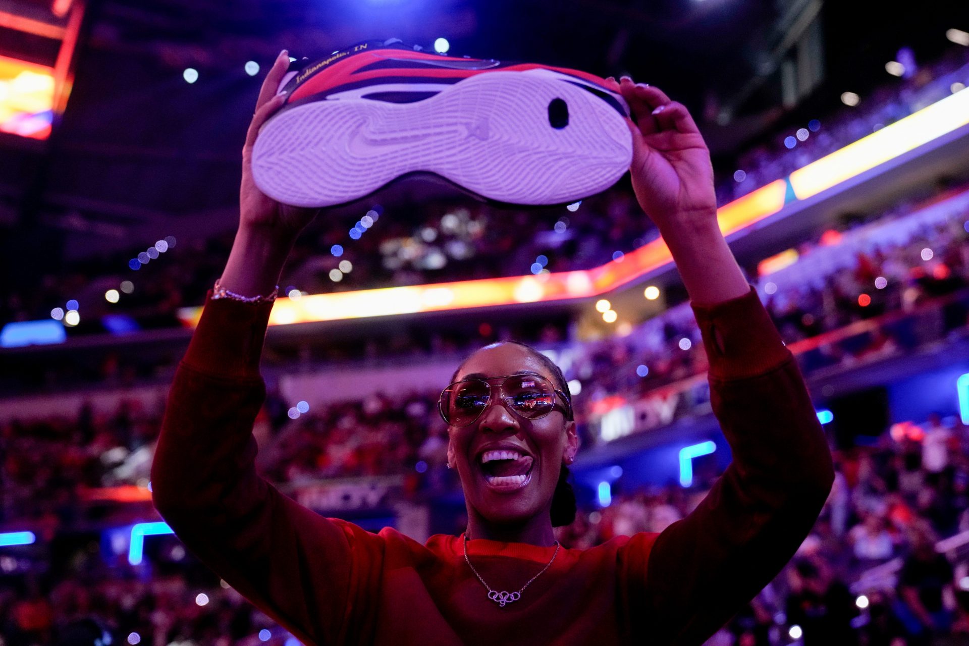 Las Vegas Aces' A’ja Wilson (22) holds up a sneaker Friday, July 18, 2025, during the WNBA All-Star skills contest at Gainbridge Fieldhouse in Indianapolis.
