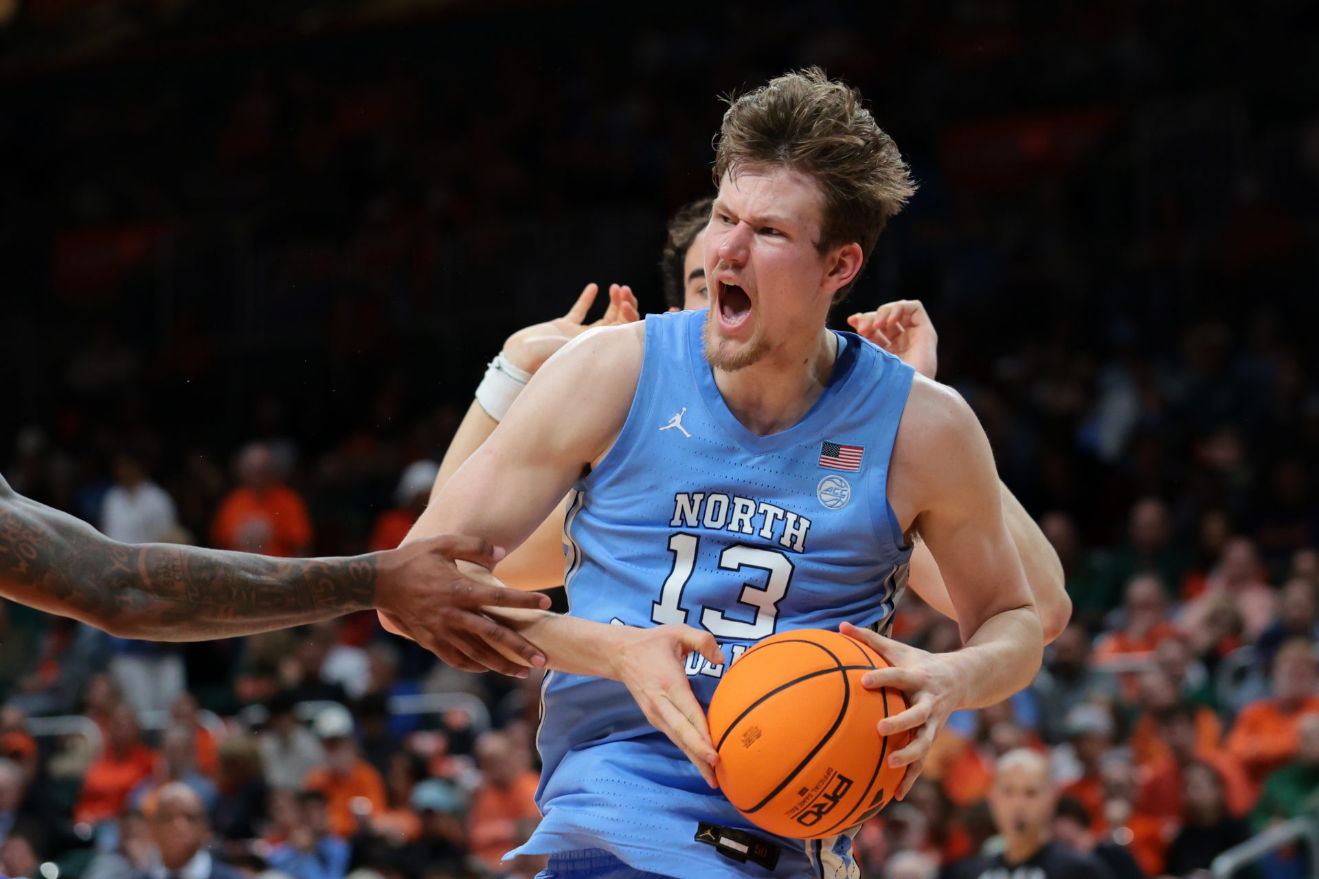 North Carolina Tar Heels center Henri Veesaar (13) grabs a rebound against the Miami Hurricanes during the first half at Watsco Center.