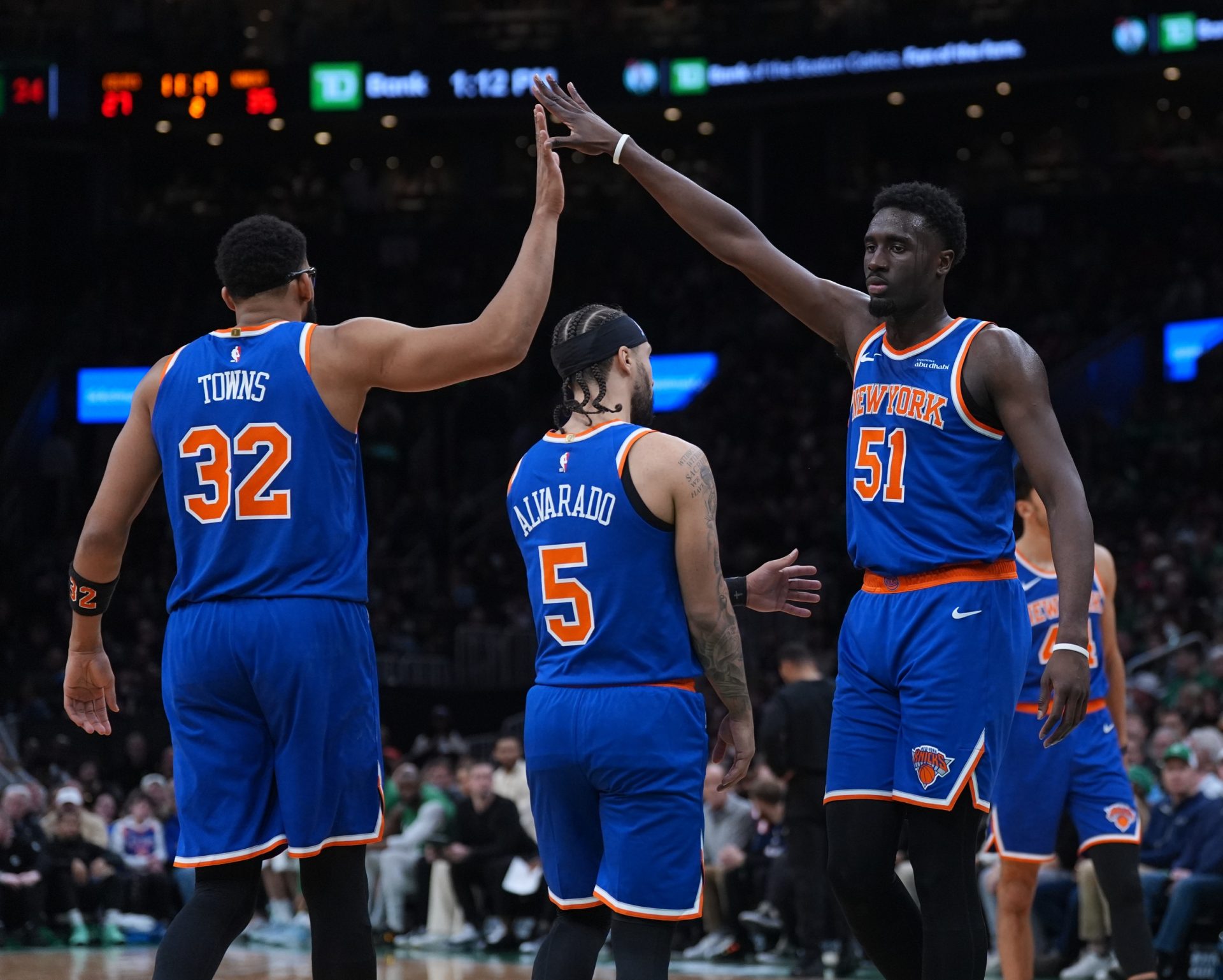 New York Knicks forward Mohamed Diawara (51) and center Karl-Anthony Towns (32) react after a play against the Boston Celtics in the second quarter at TD Garden.