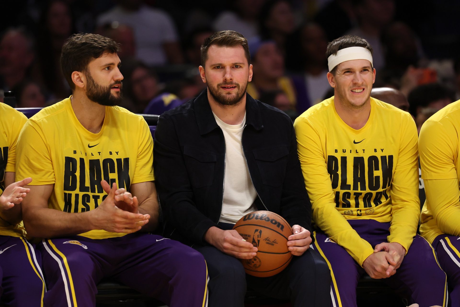 Los Angeles Lakers guard Luka Doncic (middle) watches a game against the Oklahoma City Thunder at Crypto.com Arena.