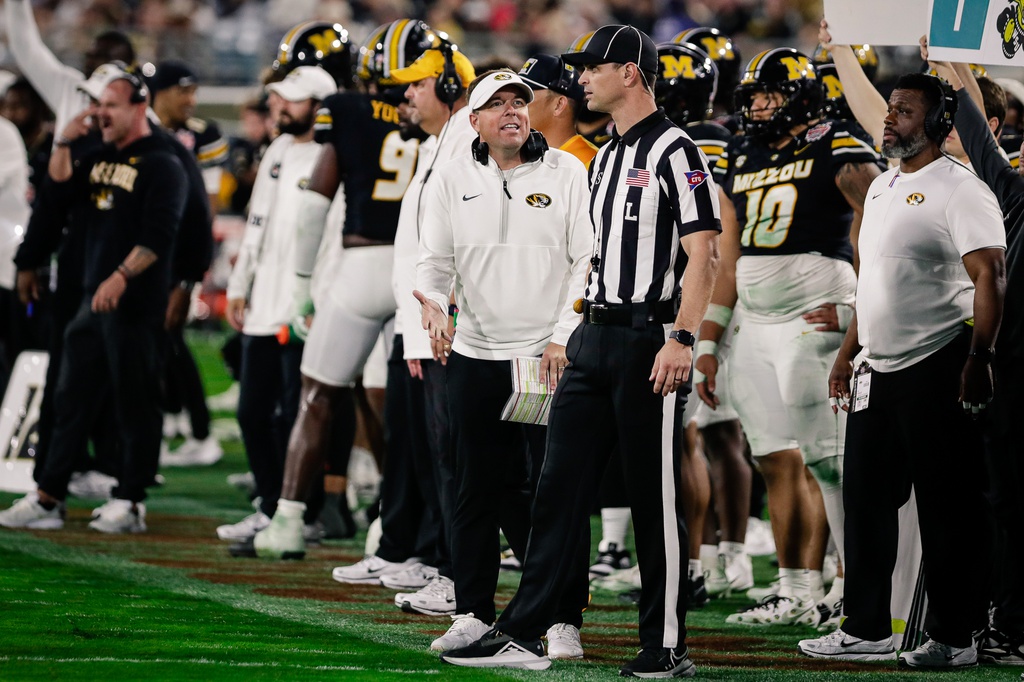 Missouri Tigers head coach Eli Drinkwitz talks with an official against the Virginia Cavaliers during the fourth quarter at EverBank Stadium.