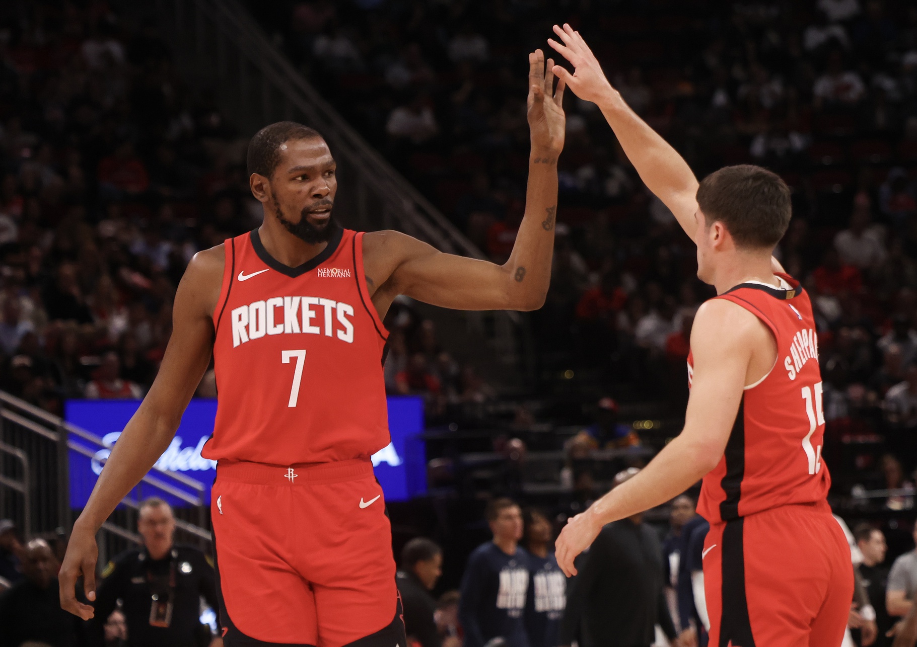 Houston Rockets forward Kevin Durant (7) celebrates guard Reed Sheppard (15) basket against the Los Angeles Clippers in the second quarter at Toyota Center.