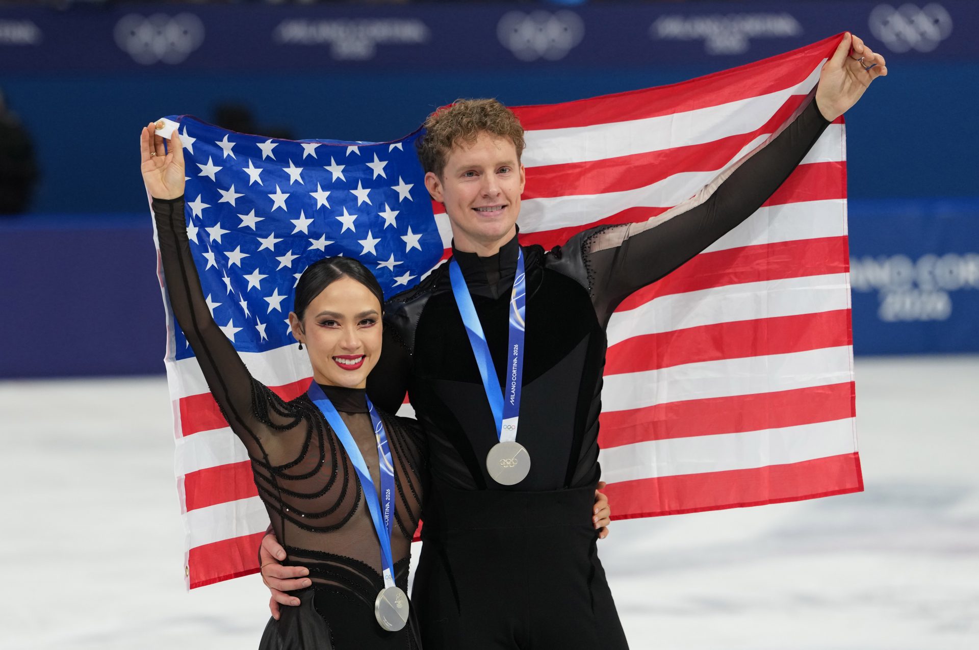 iFeb 11, 2026; Milan, Italy; Madison Chock and Evan Bates of the United States skate after receiving silver medals during the Milano Cortina 2026 Olympic Winter Games at Milano Ice Skating Arena.