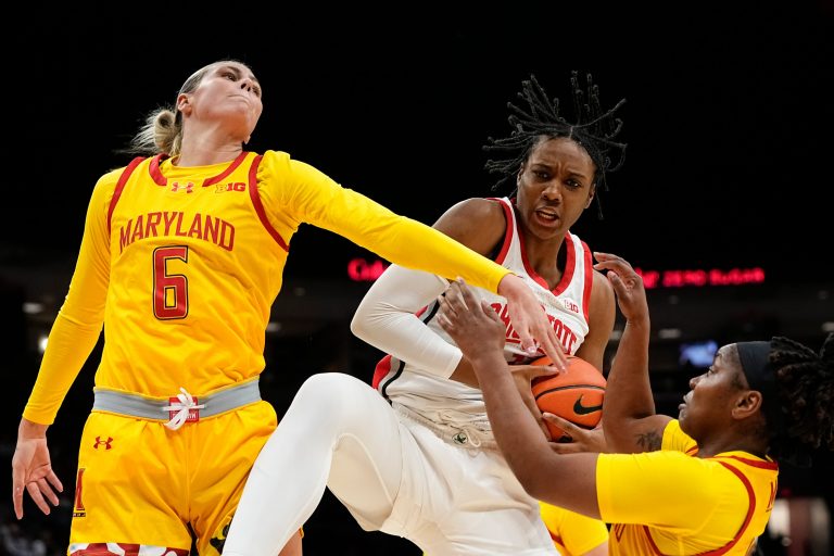 Ohio State Buckeyes forward Ajae Petty (1) grabs a rebound away from Maryland Terrapins guard Saylor Poffenbarger (6) and guard Sarah Te-Biasu (1) during the first half of the NCAA women's basketball game at Value City Arena on Jan. 23, 2025.