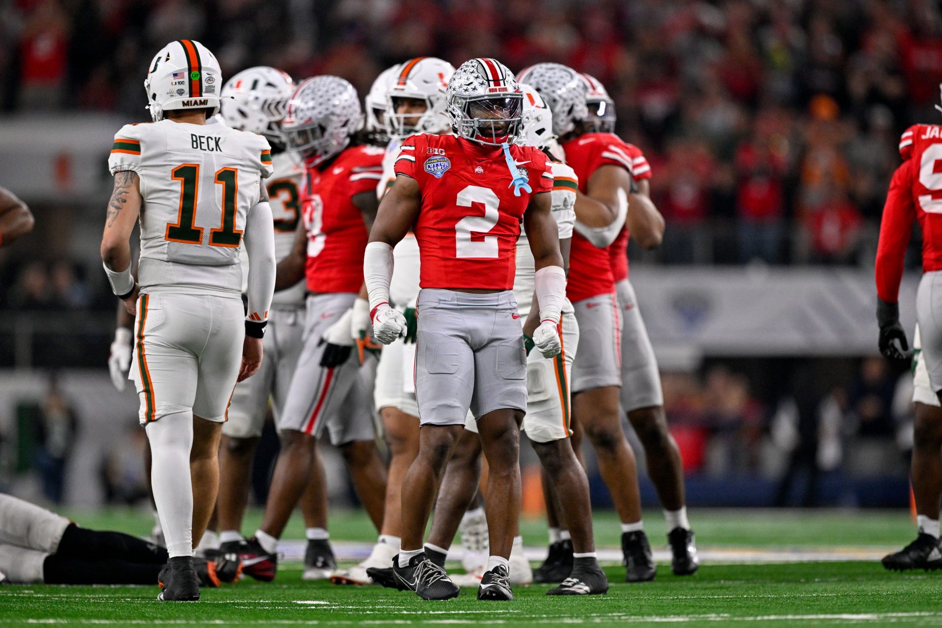 Ohio State Buckeyes safety Caleb Downs (2) celebrates a defensive stop during the 2025 Cotton Bowl and quarterfinal game of the College Football Playoff at AT&T Stadium.