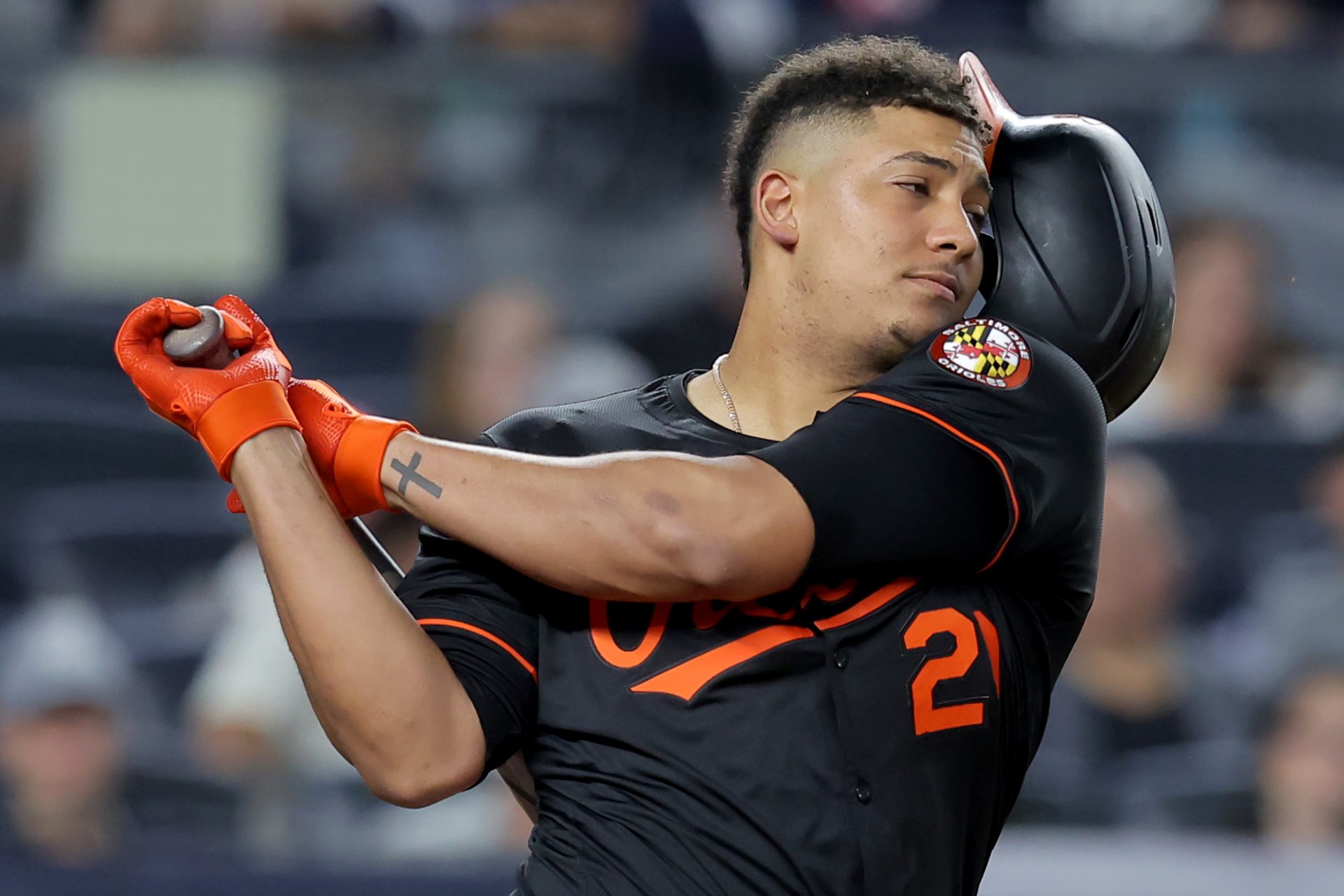 Baltimore Orioles designated hitter Samuel Basallo (29) loses his helmet while swinging at a pitch during the sixth inning against the New York Yankees at Yankee Stadium.