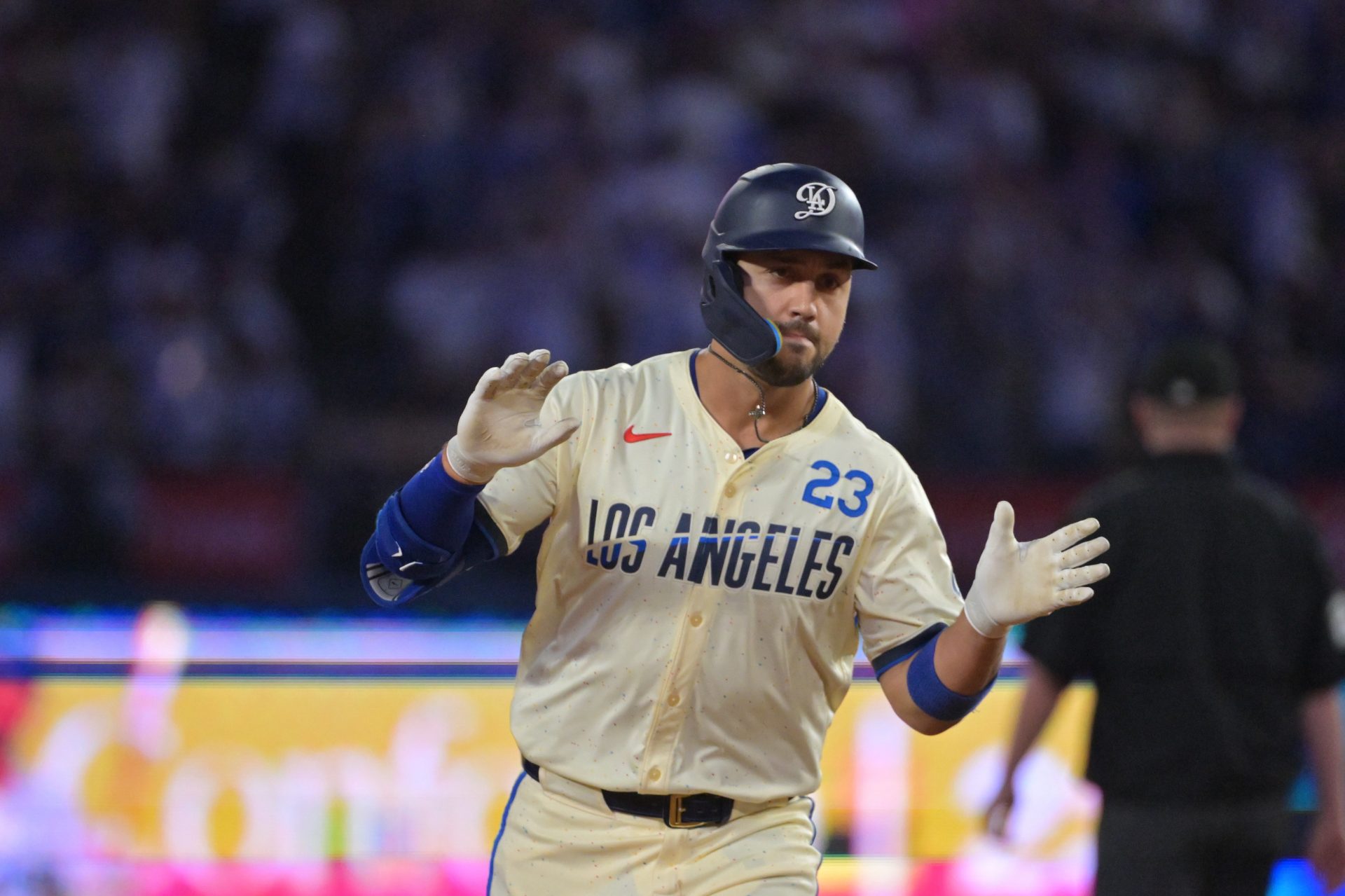 Los Angeles Dodgers outfielder Michael Conforto (23) reacts after scoring a run during the third inning against the San Francisco Giants at Dodger Stadium.