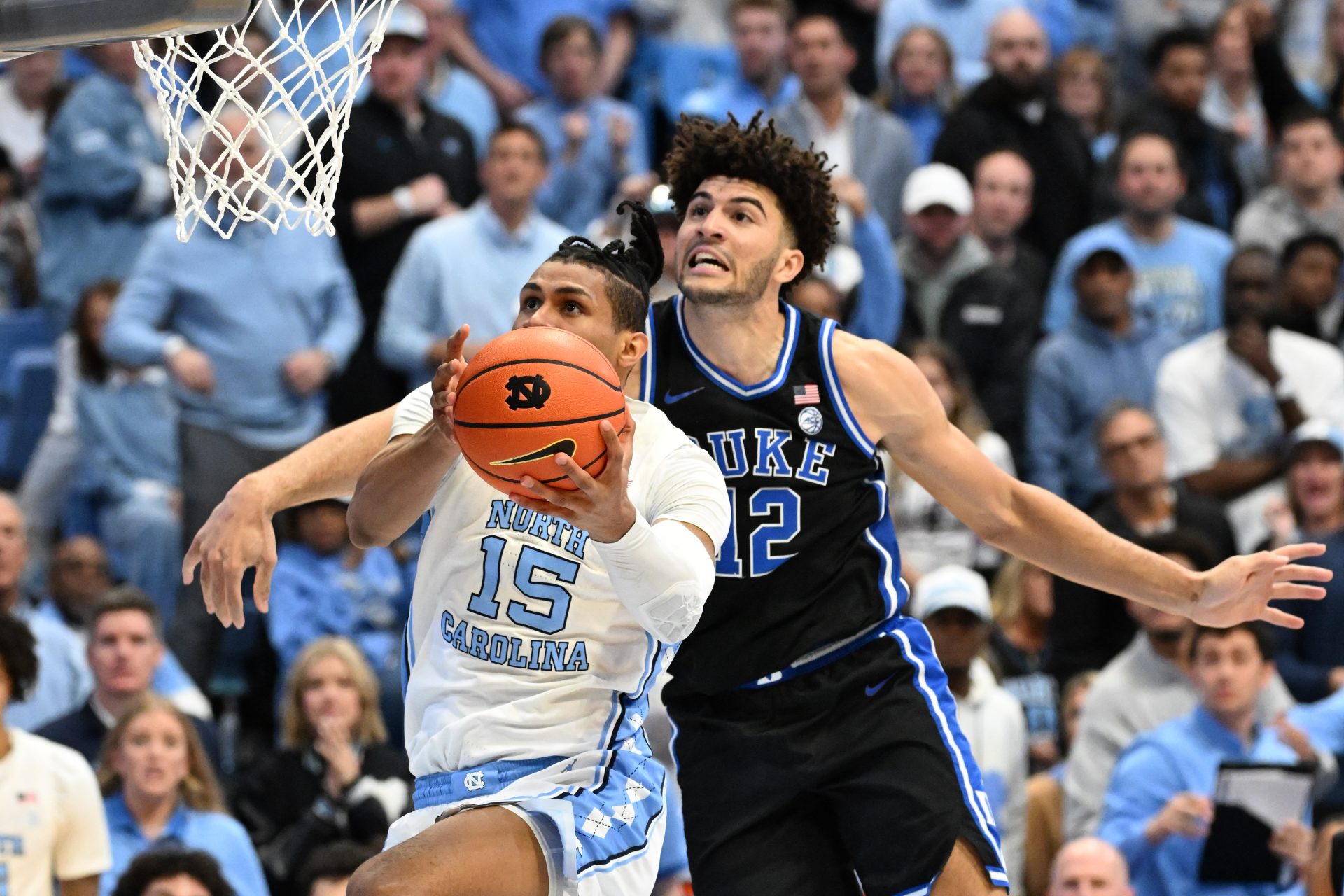 North Carolina Tar Heels forward Jarin Stevenson (15) shoots as Duke Blue Devils forward Cameron Boozer (12) defends in the second half at Dean E. Smith Center.