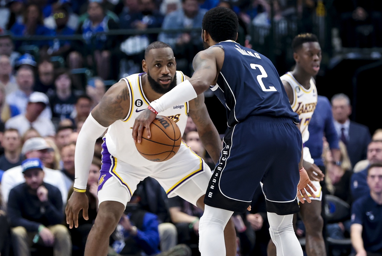 Los Angeles Lakers forward LeBron James (6) guards Dallas Mavericks guard Kyrie Irving (2) during the fourth quarter at American Airlines Center.