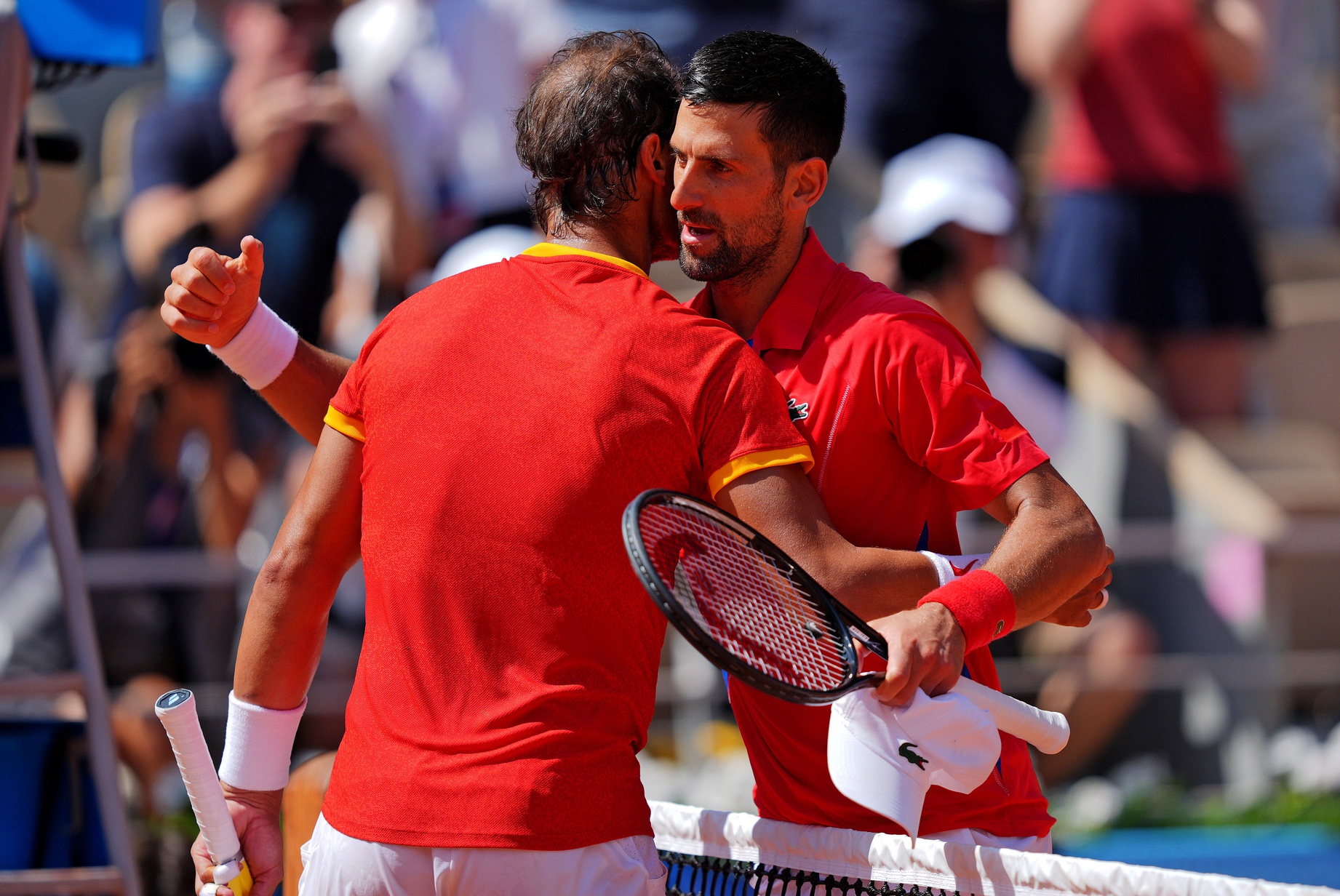Novak Djokovic (SRB) shakes hands with Rafael Nadal (ESP) after their match in the men’s tennis sinlges first round during the Paris 2024 Olympic Summer Games at Stade Roland Garros.